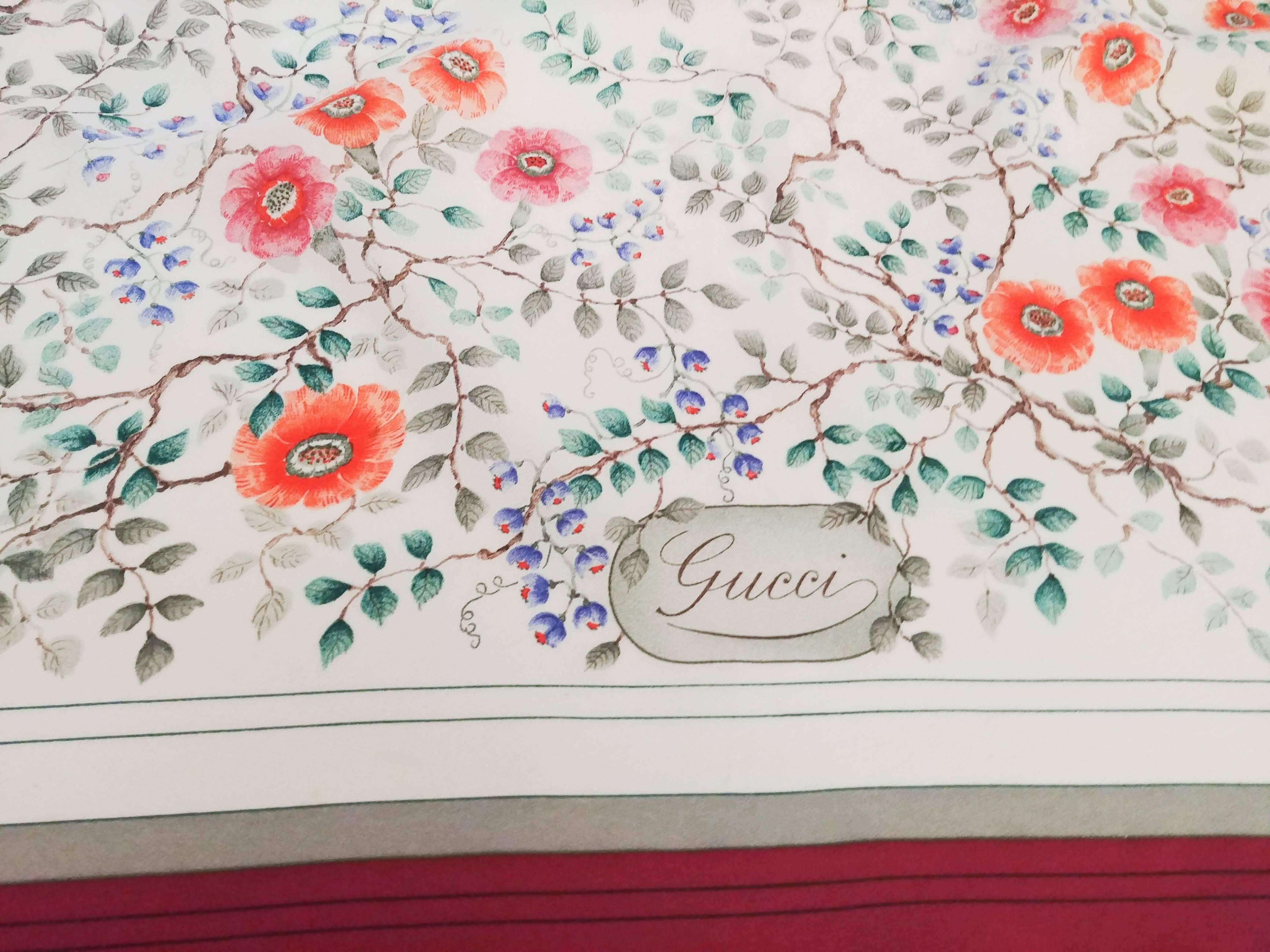 Gucci Floral Print Silk Scarf, 1970s. Red border, printed flowers on white background. Hand rolled.