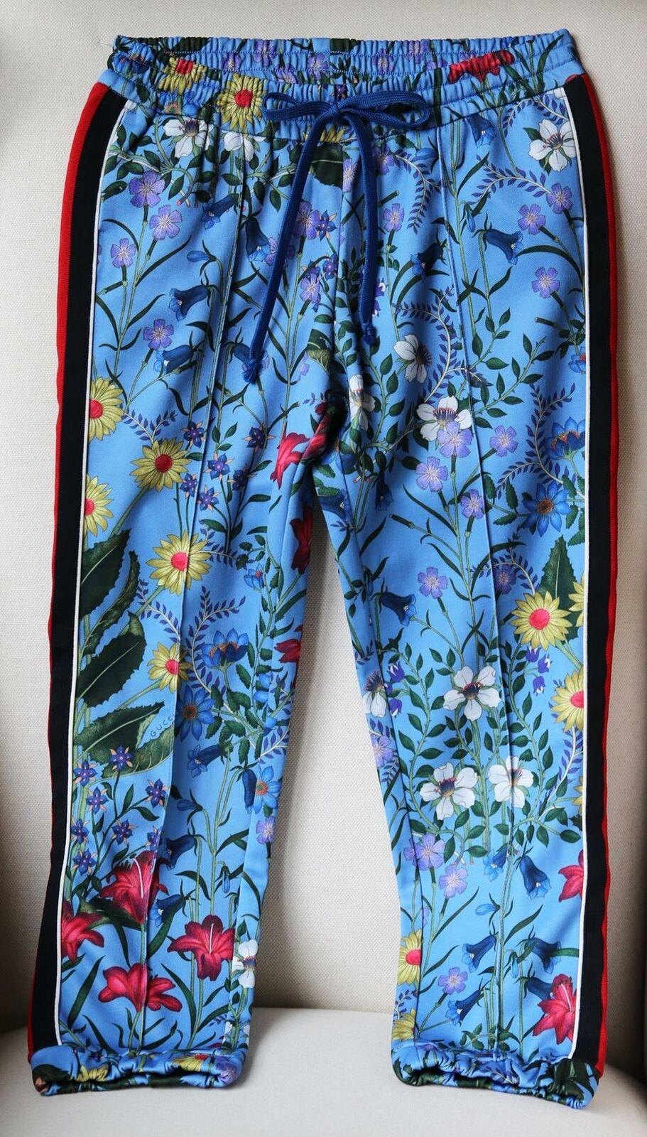 These Gucci track pants are the perfect update to a pair of retro vibe.
Italian-made from lustrous floral-print blue tech-jersey, they have raised seams at the front and comfortable elasticated trims. 
Multicoloured tech-jersey.
Pull on. 
55%