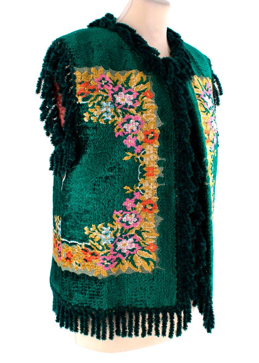 Gucci Floral Velvet Jacquard Tapestry Gilet
 

 - Look 69 SS19 runway
 - Tapestry gilet in emerald green with floral motif rendered in tones of pink, yellow and orange
 - Round neck, sleeveless
 - Chenille fringed edes
 - Pink satin quilted lining 
