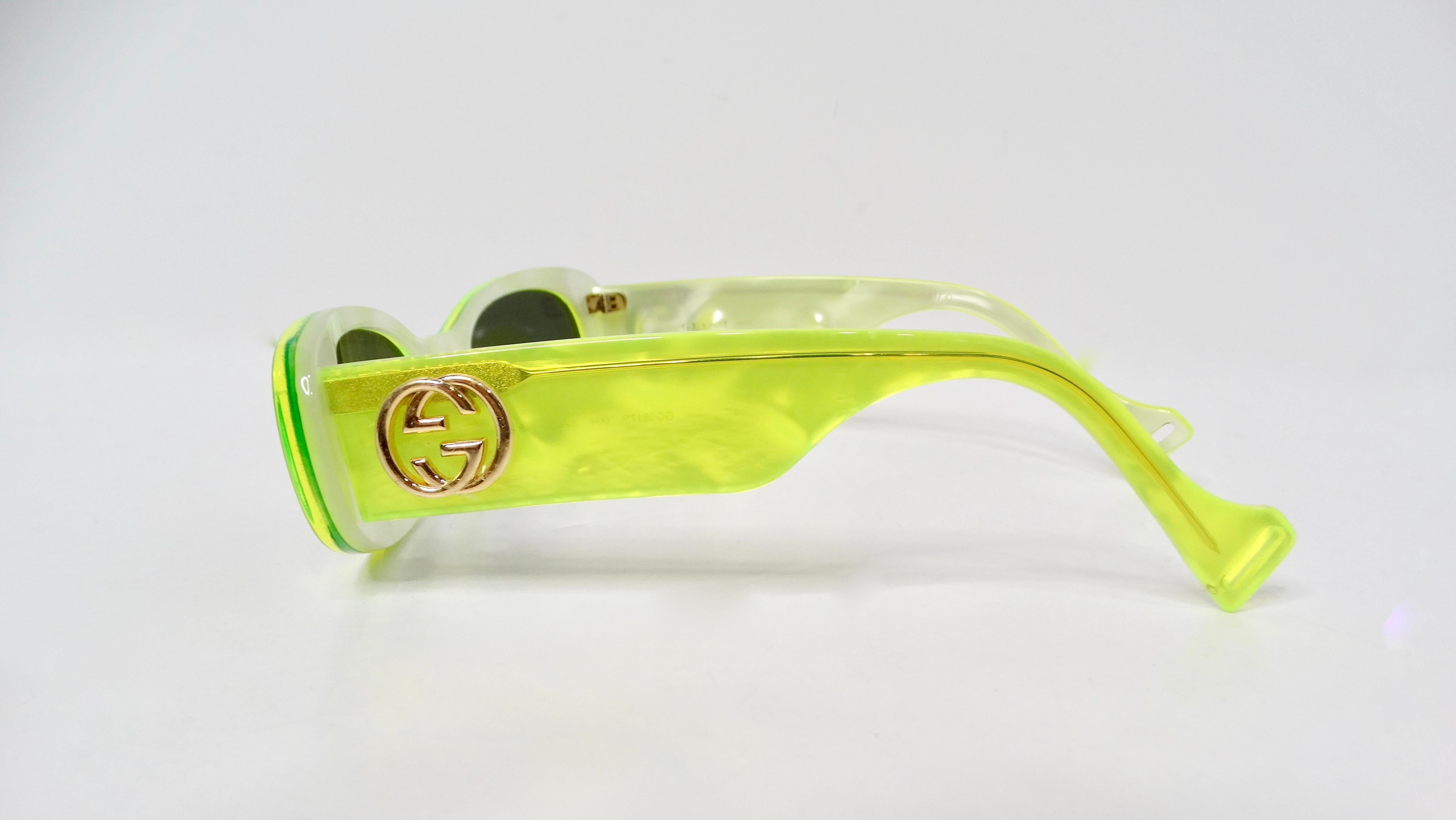 Introducing the Gucci Fluorescent Neon Yellow Acetate Rectangular Tinted Sunglasses, a bold accessory that epitomizes contemporary luxury and vibrant style. Crafted from high-quality acetate, these sunglasses feature an eye-catching neon yellow