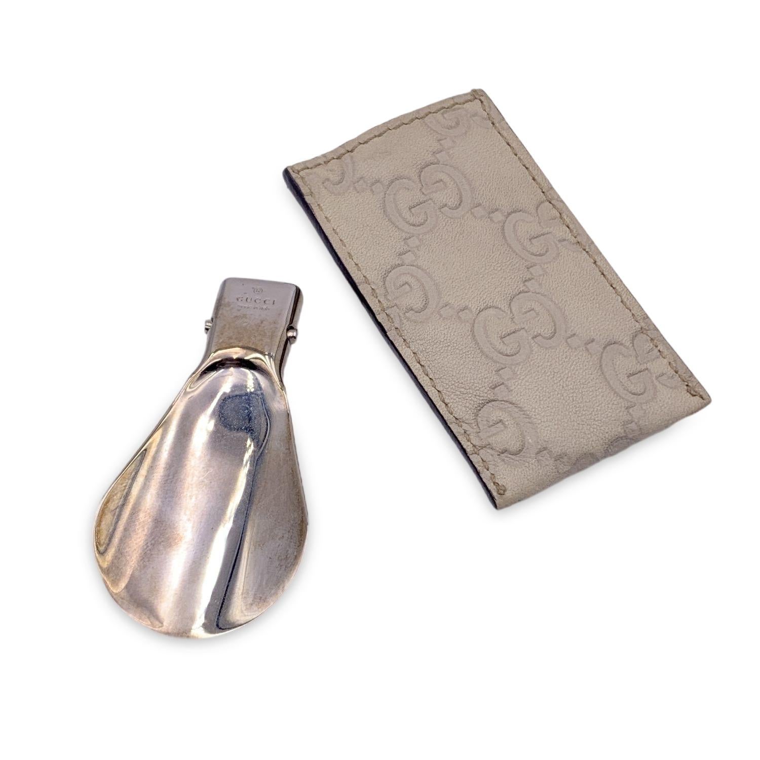 Foldable silver metal mini shoe horn by GUCCI with white Guccissima leather case. 'GUCCI Made in Italy' engraved on the shoehorn. Total lenght: 4.5 inches - 11.4 cm



Details

MATERIAL: Metal

COLOR: Silver

MODEL: n.a.

GENDER: Unisex