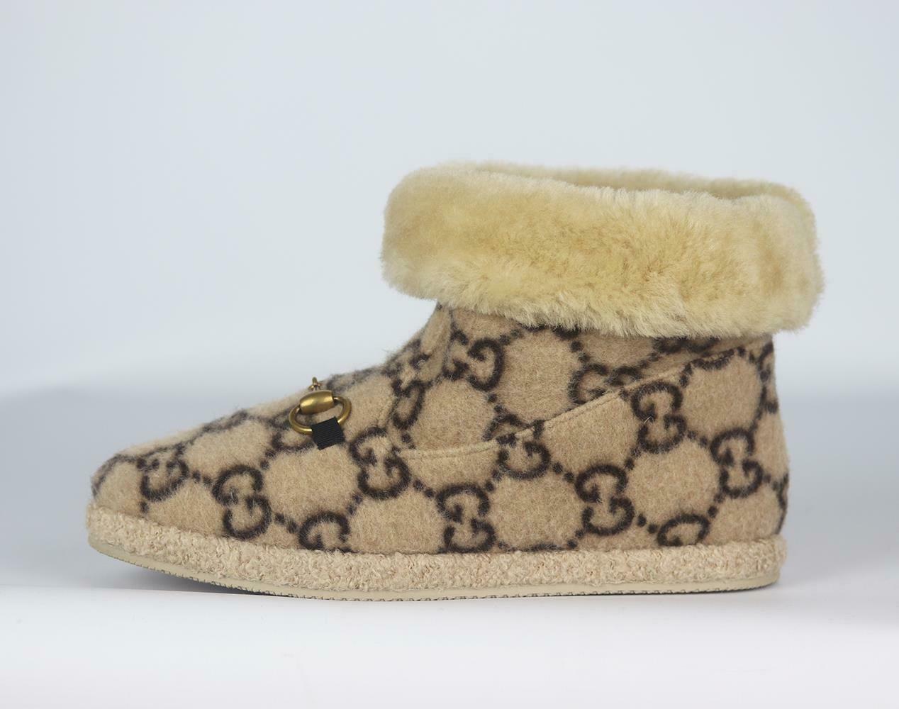 Inspired by traditional slippers, Gucci's 'Fria' ankle boots are ideal for lounging at home in or running errands at the weekend, they've been made in Italy from soft wool patterned with the house's 'GG' motif and are embellished with a gold