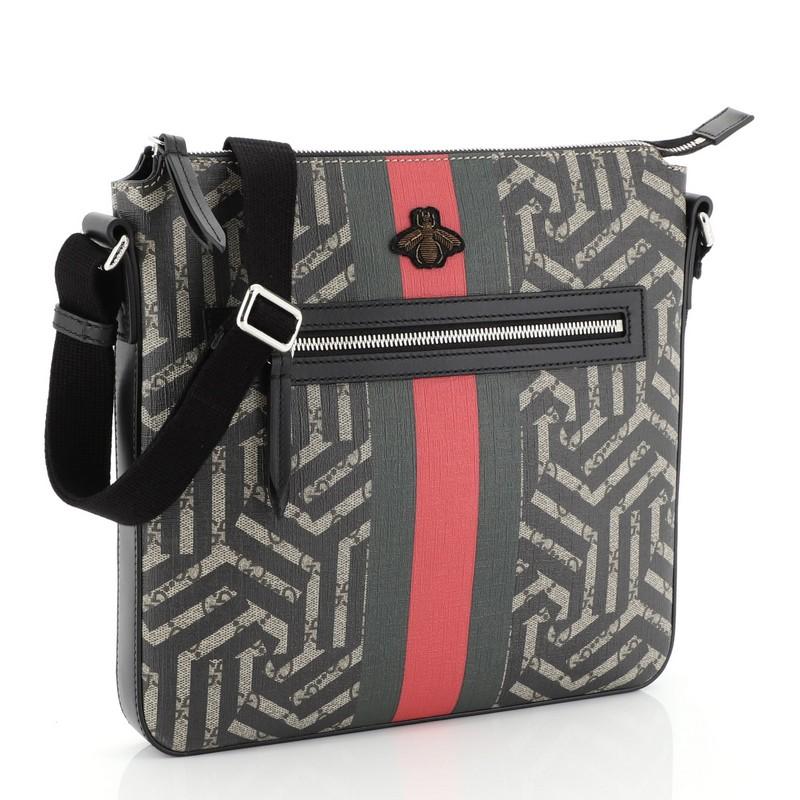 This Gucci Front Zip Messenger Caleido Print GG Coated Canvas Medium, crafted in brown Caleido print GG coated canvas, features an adjustable strap, web with embroidered bee detail, front zip pocket and silver-tone hardware. Its top zip closure