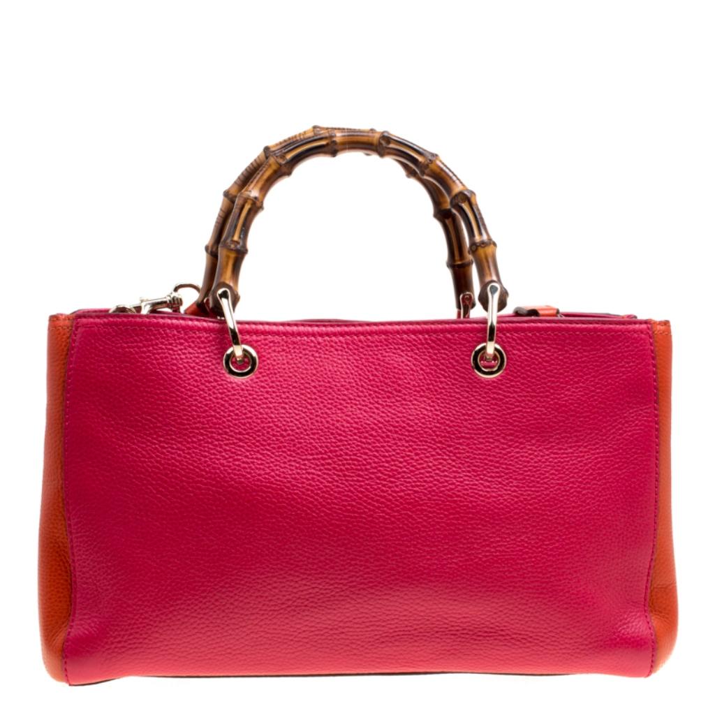 Handbags as fabulous as this one are hard to come by. So, own this gorgeous Gucci bag today and light up your closet! Crafted from Fuchsia leather and fitted with orange gussets, this stunning number has a spacious canvas interior and is wonderfully