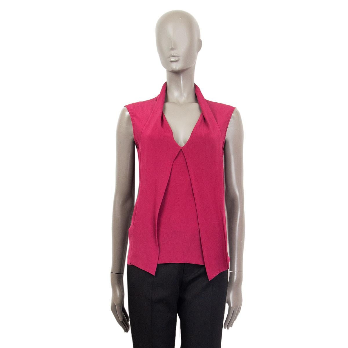 100% authentic Gucci v-neck sleeveless blouse in fuchsia silk (100%). Tie detail at front. Has been worn and is in excellent condition.

Measurements
Tag Size	40
Size	S
Shoulder Width	42cm (16.4in)
Bust To	86cm (33.5in)
Waist To	82cm (32in)
Hips