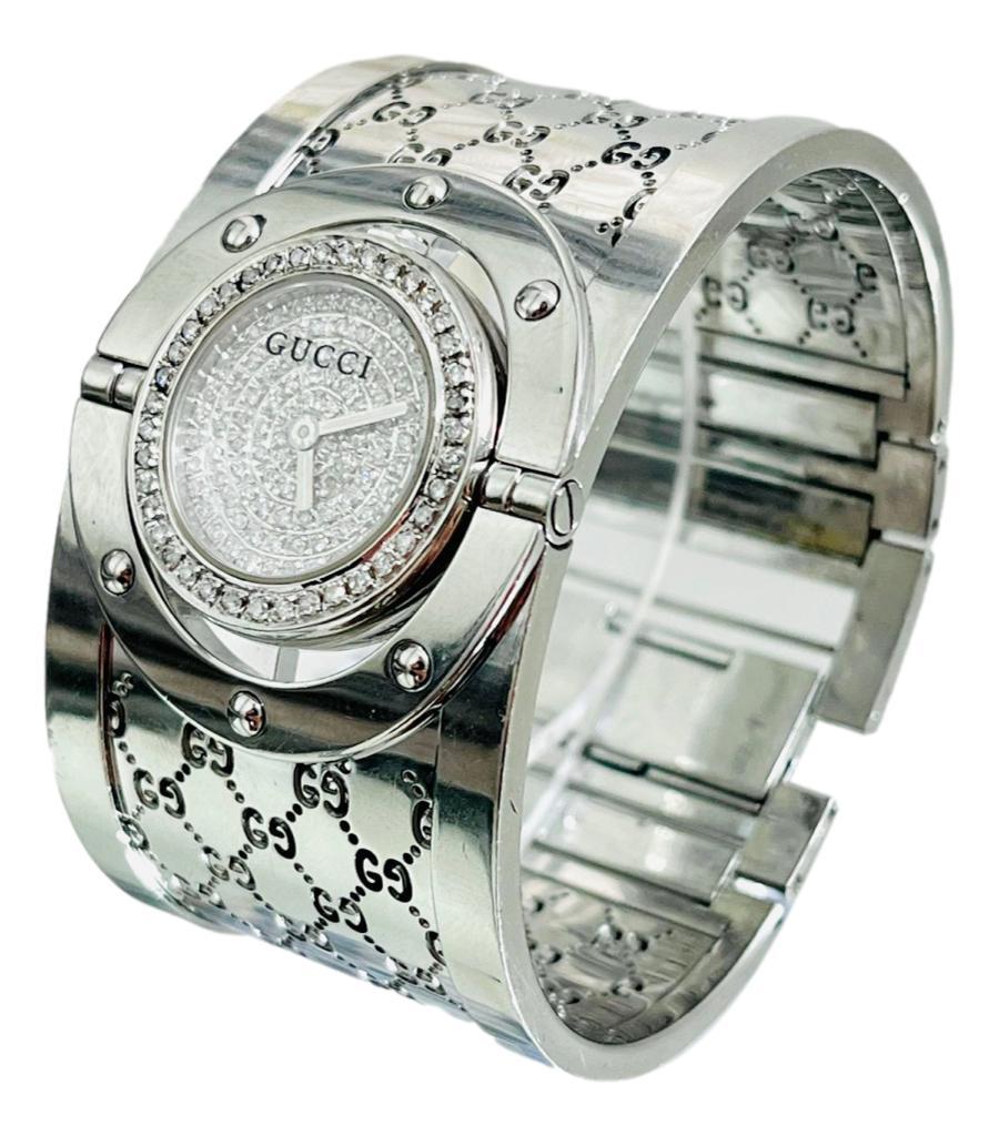 Rare Model - Gucci Full Pave Diamond Face - Twirl Watch 

This is a rare version of this watch with full brilliant white pave diamond face.

Twist the face to wear either with watch face showing or just as a bangle with 

the logo showing. Sapphire