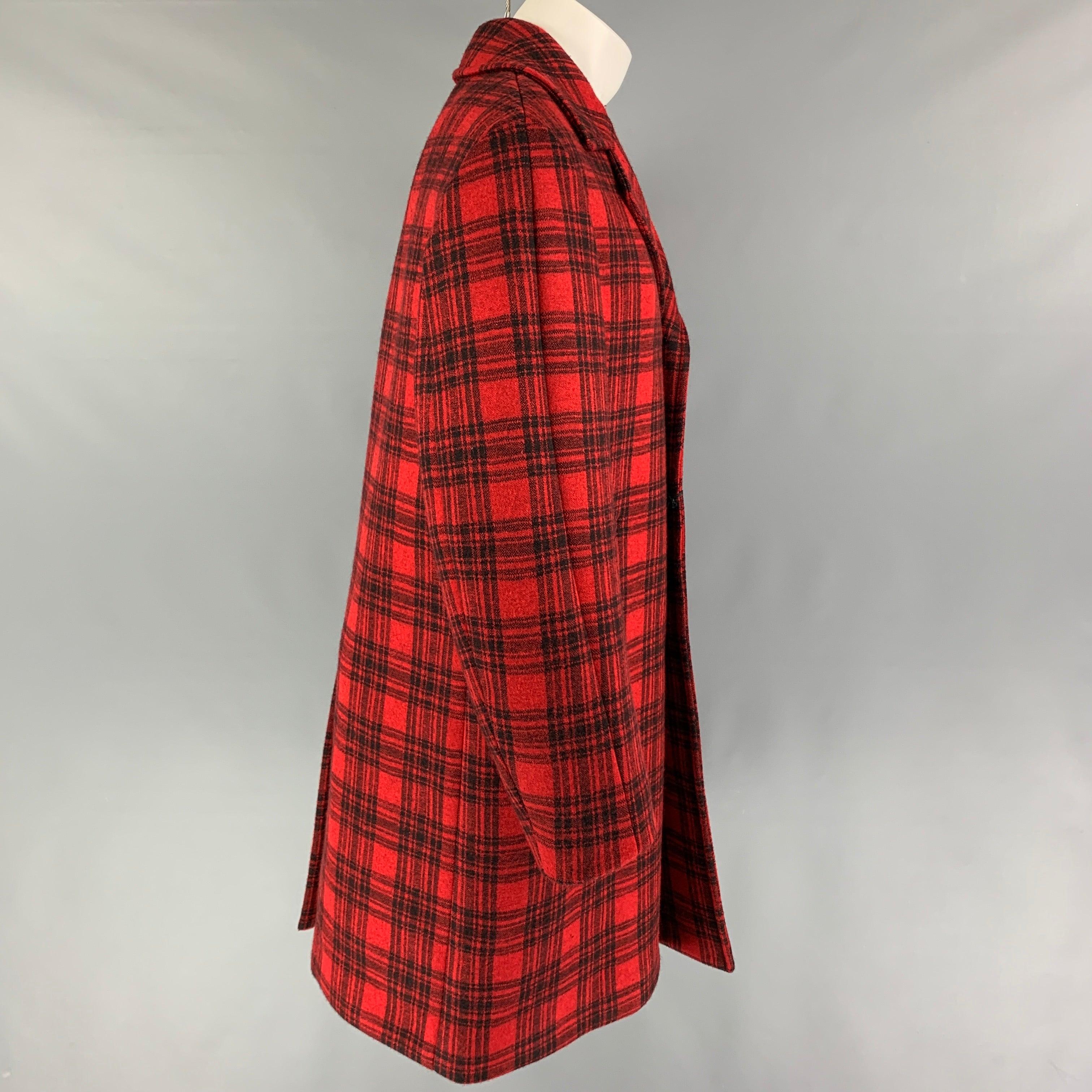 GUCCI FW 16
coat comes in a red & black plaid wool blend with a full liner featuring a notch lapel, oversized, slit pockets, single back vent, and a buttoned closure. Made in Italy. New With Tags. 

Marked:  50 

Measurements: 
 
Shoulder: 19 inches