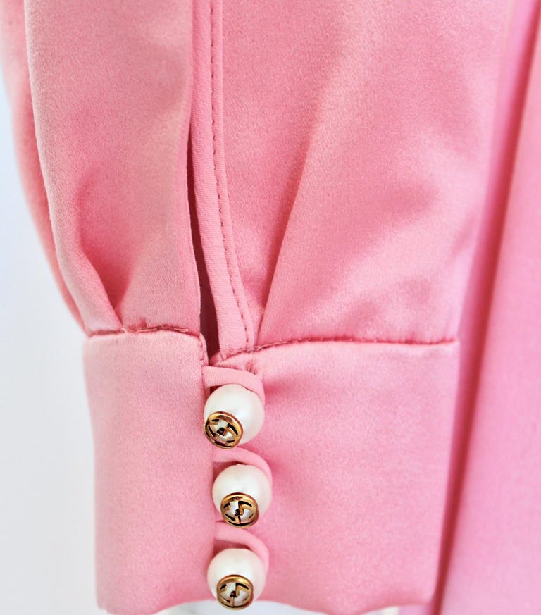 gucci pink snake dress A little history on THAT dress  One of Tom Ford for Gucci's most  well-known and fought after dresses. Presenting a pink snake print viscose  with a plunging neckline dress. This piece