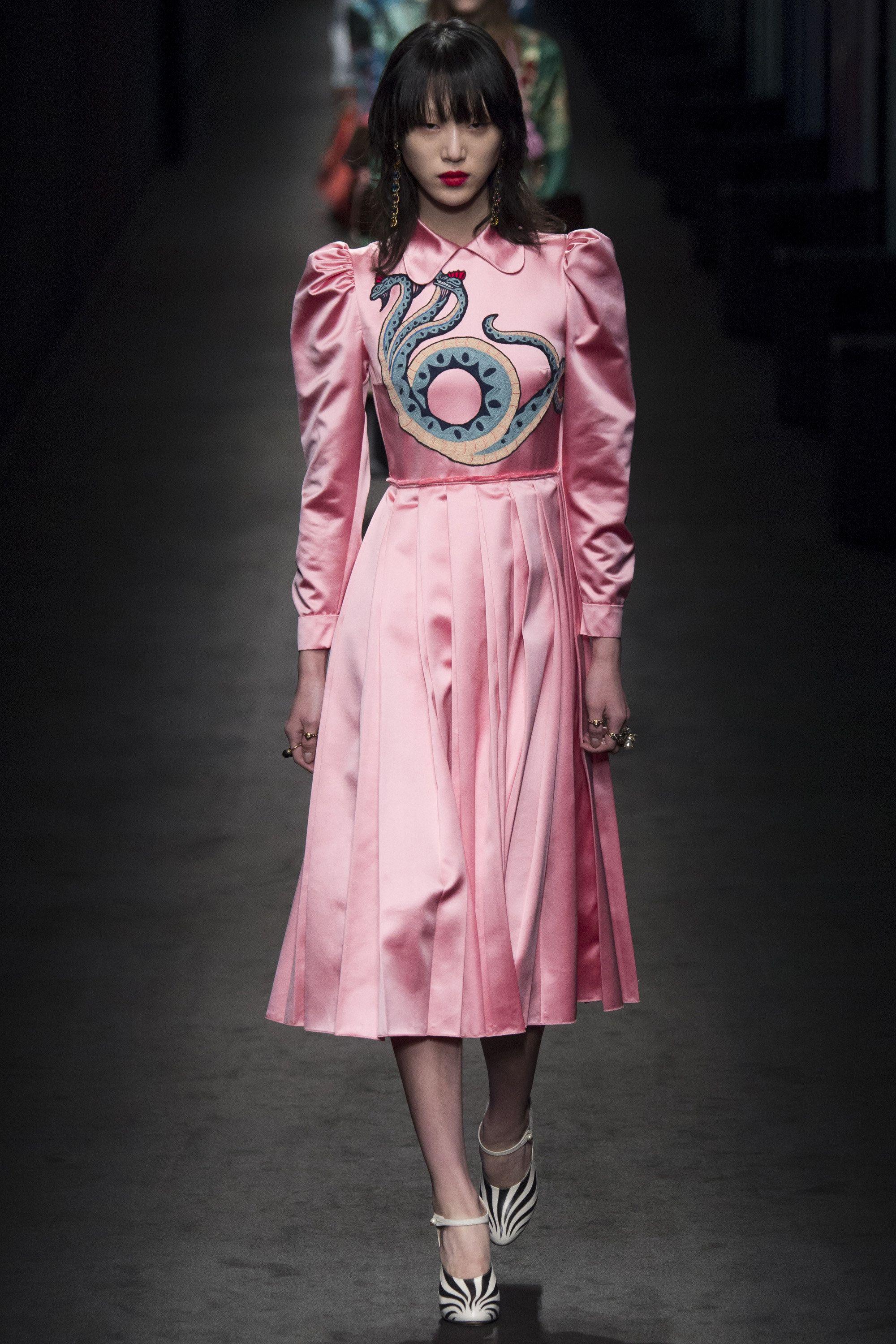 
SHOWSTOPPER
The most fabulous GUCCI dress!
FW 2016 Collection, runway look
Pink silk puffed sleeve dress with pleated skirt and snake embroidery across bodice.
Gold coloured zipper on the back back as well as 