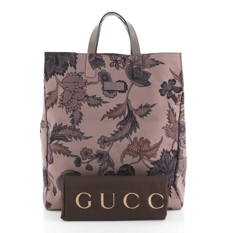 This Gucci G-Active Knight Tote Flora Canvas Tall is a perfect tote for everyday use, ideal for carrying all your essentials. Crafted in purple flora canvas, features dual flat leather handles and aged silver-tone hardware. Its wide-open top
