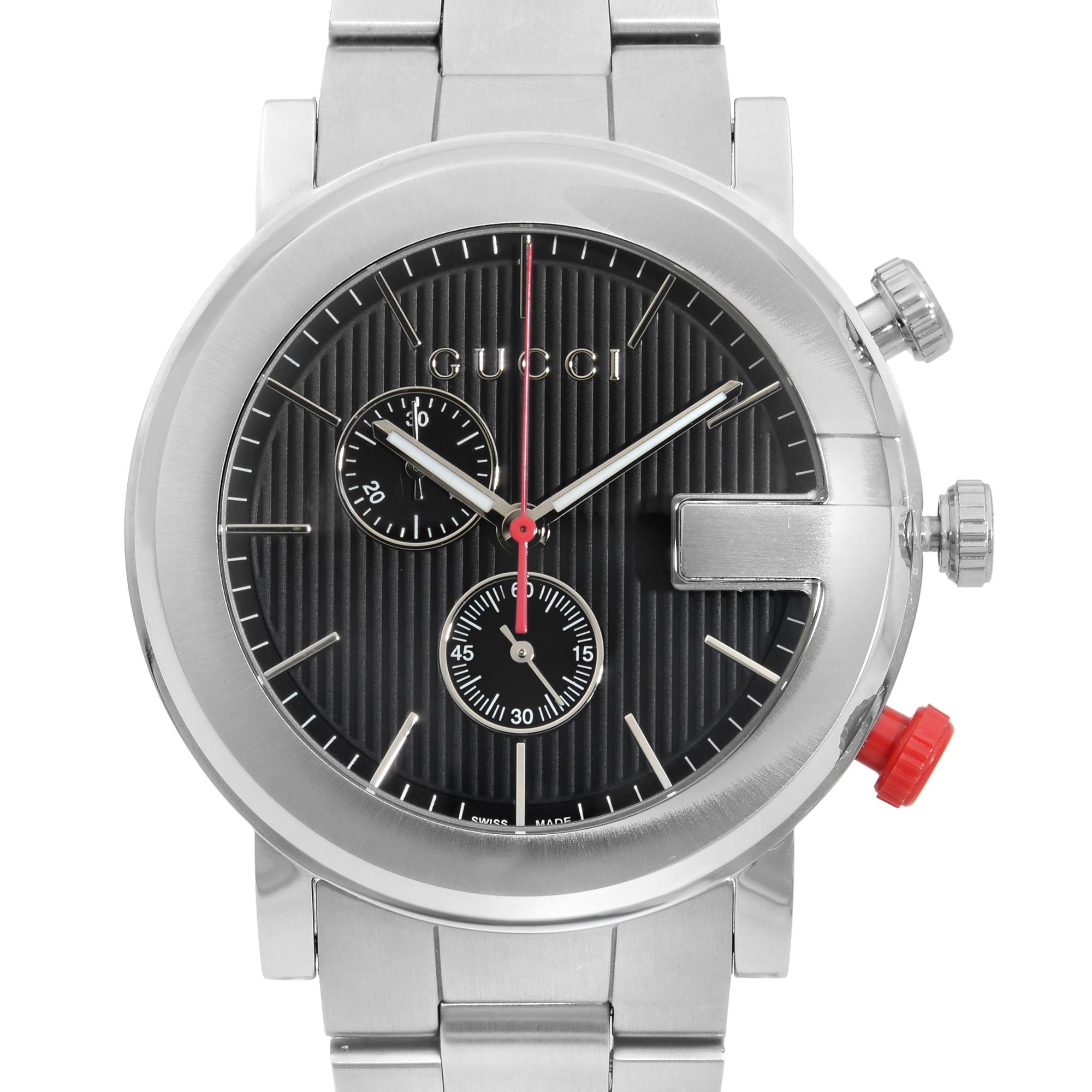 This display model Gucci G-Gucci YA101361  is a beautiful men's timepiece that is powered by quartz (battery) movement which is cased in a stainless steel case. It has a round shape face,  dial and has hand sticks style markers. It is completed with