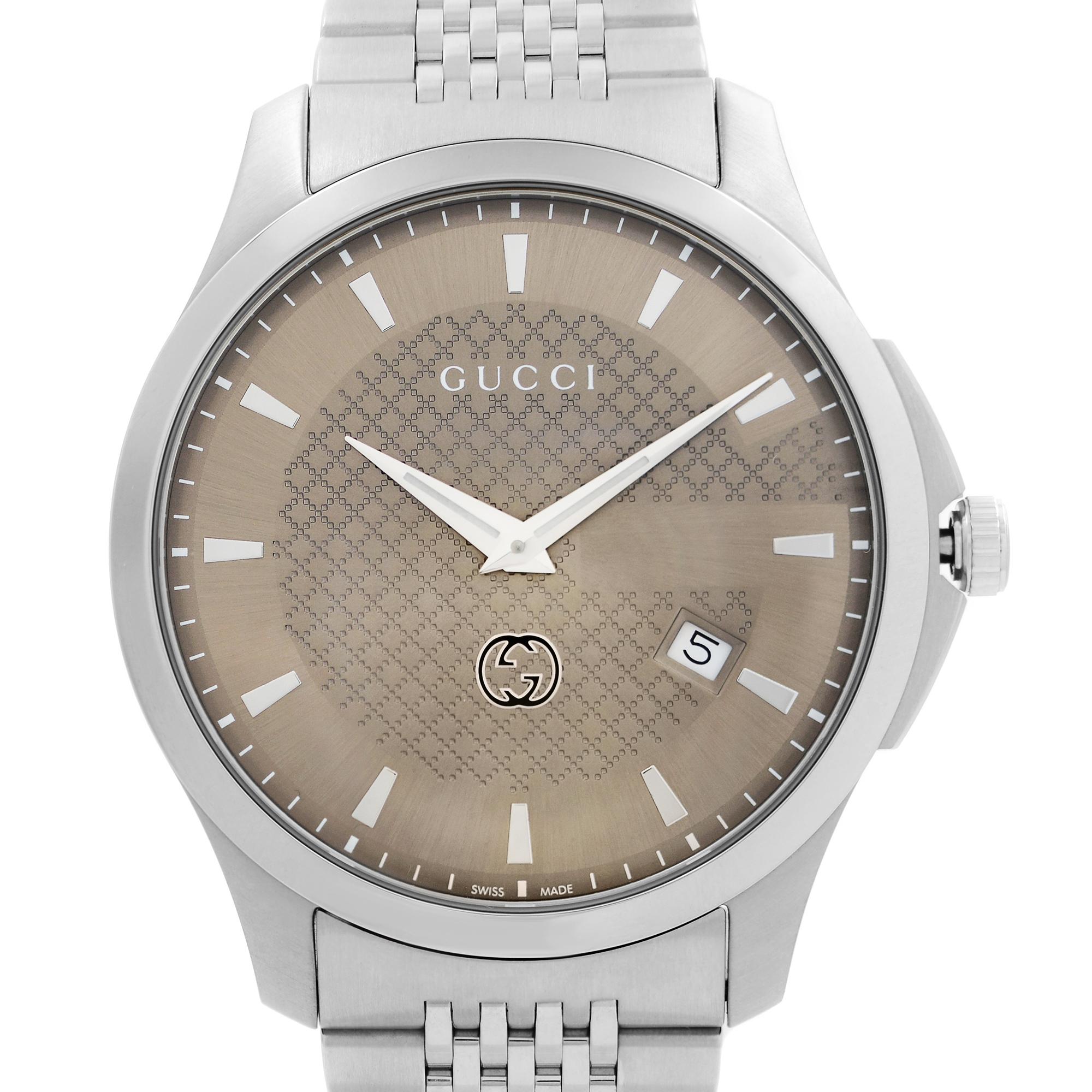 Display Model Gucci G-Timeless Stainless Steel Brown Diamond Pattern Men's Watch. GG Cross Logo On Dial. This Beautiful Timepiece Features: Stainless Steel Case & Bracelet, Quartz Movement, 50m Water Resistance. Comes with Original Box and