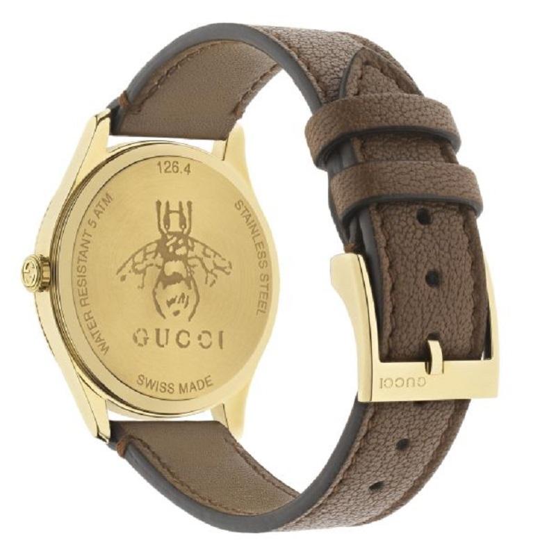 The Gucci G-Timeless collection continues to explore emblematic House codes in new ways each season. A recognizable Gucci symbol, the bee appears as a subtle detail atop this watch. The style in silver sunbrushed dial is paired with a brown lambskin