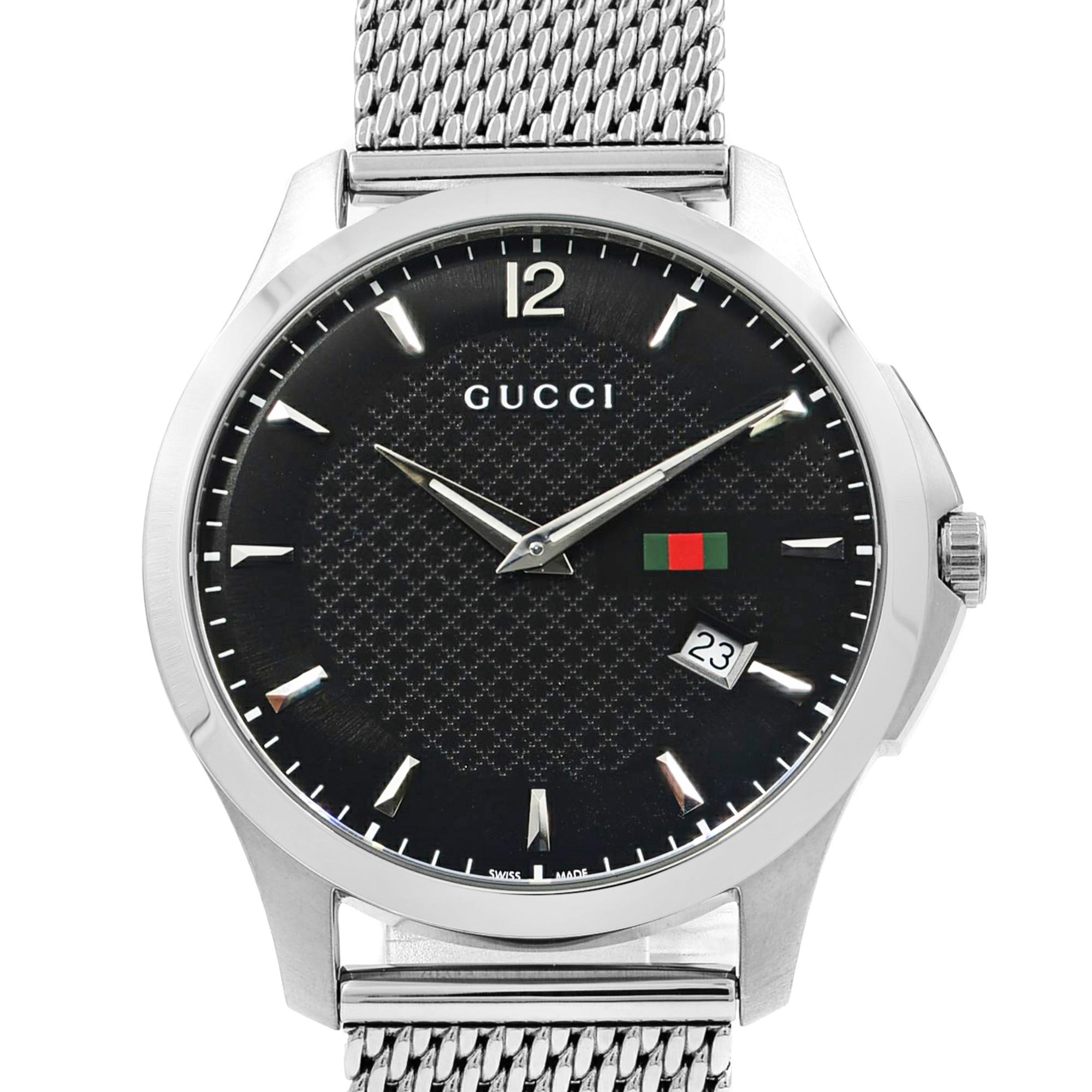 This pre-owned Gucci G-Timeless YA126308 is a beautiful men's timepiece that is powered by quartz (battery) movement which is cased in a stainless steel case. It has a round shape face, date indicator dial and has hand sticks style markers. It is