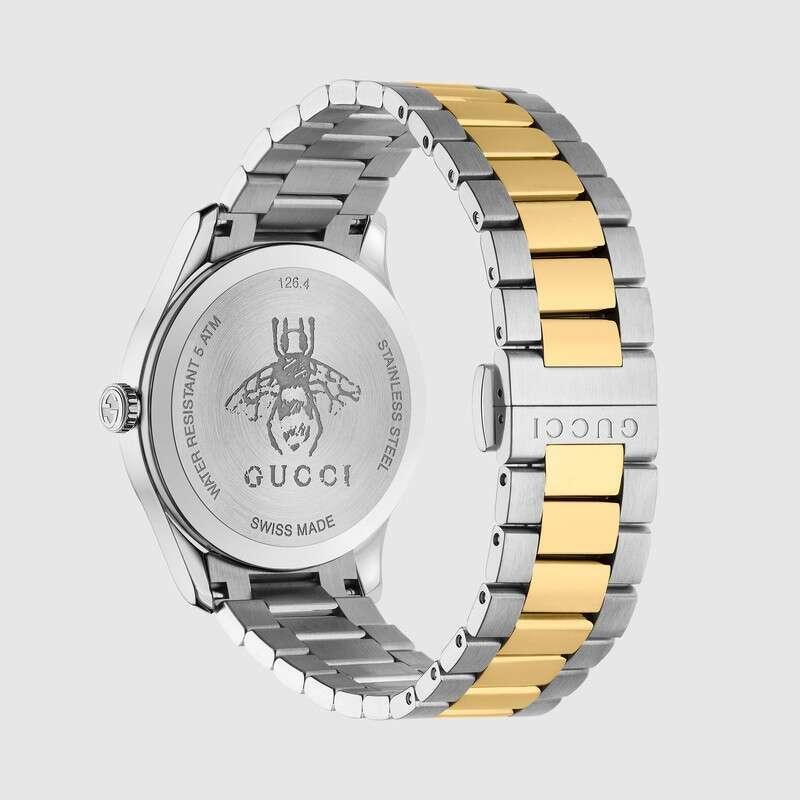 This model has stainless steel 38mm case featuring silver sunbrushed dial with central yellow gold bee motif. This model has a quartz movement and is water resistant to 50 metres. Presented on a stainless steel and yellow gold PVD bracelet with