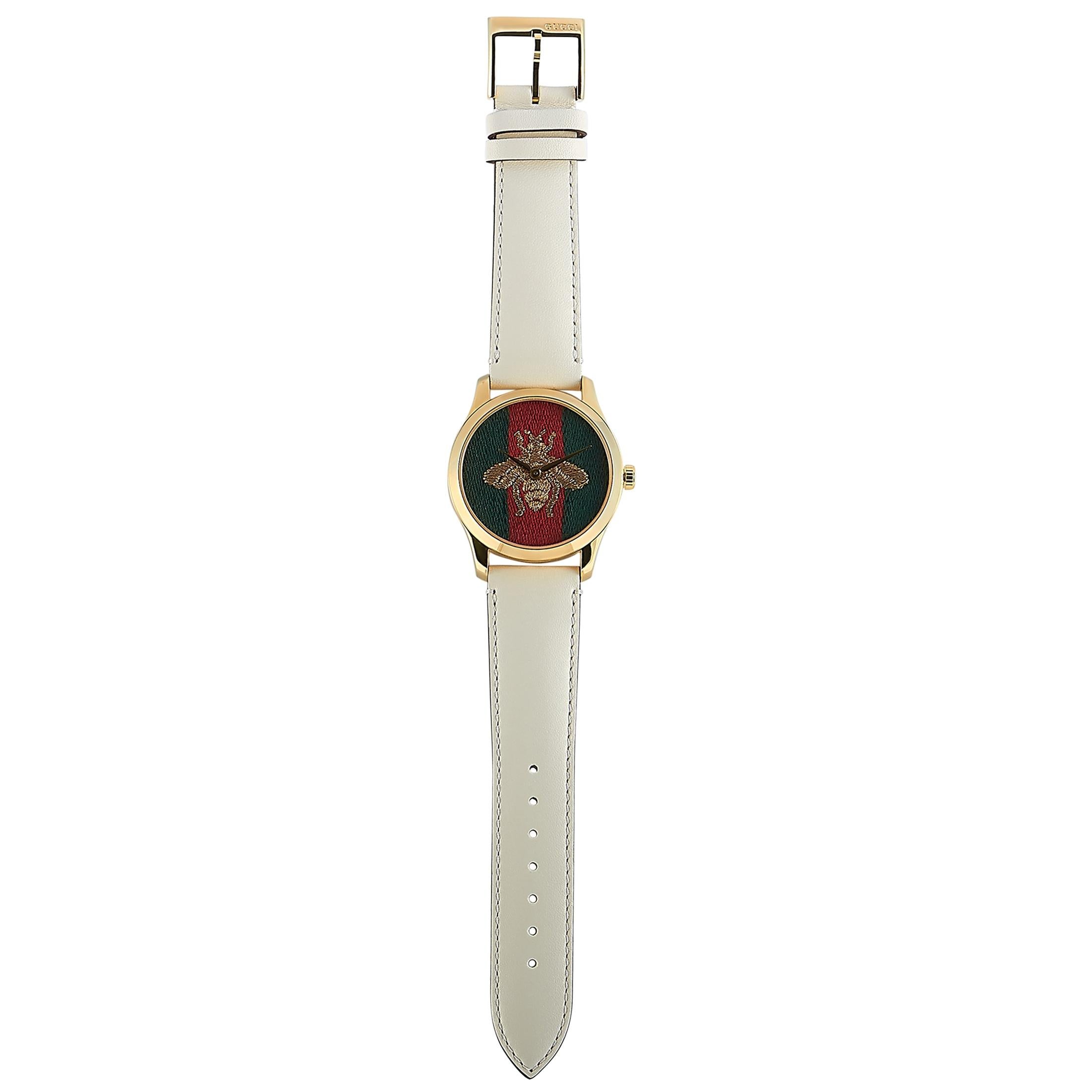 The Gucci G-Timeless, reference number YA1264128, is a member of the exceptional “G-Timeless” collection.

The watch is presented with a 38 mm yellow gold PVD-plated stainless steel case that is water-resistant to 50 meters. The case is mounted onto
