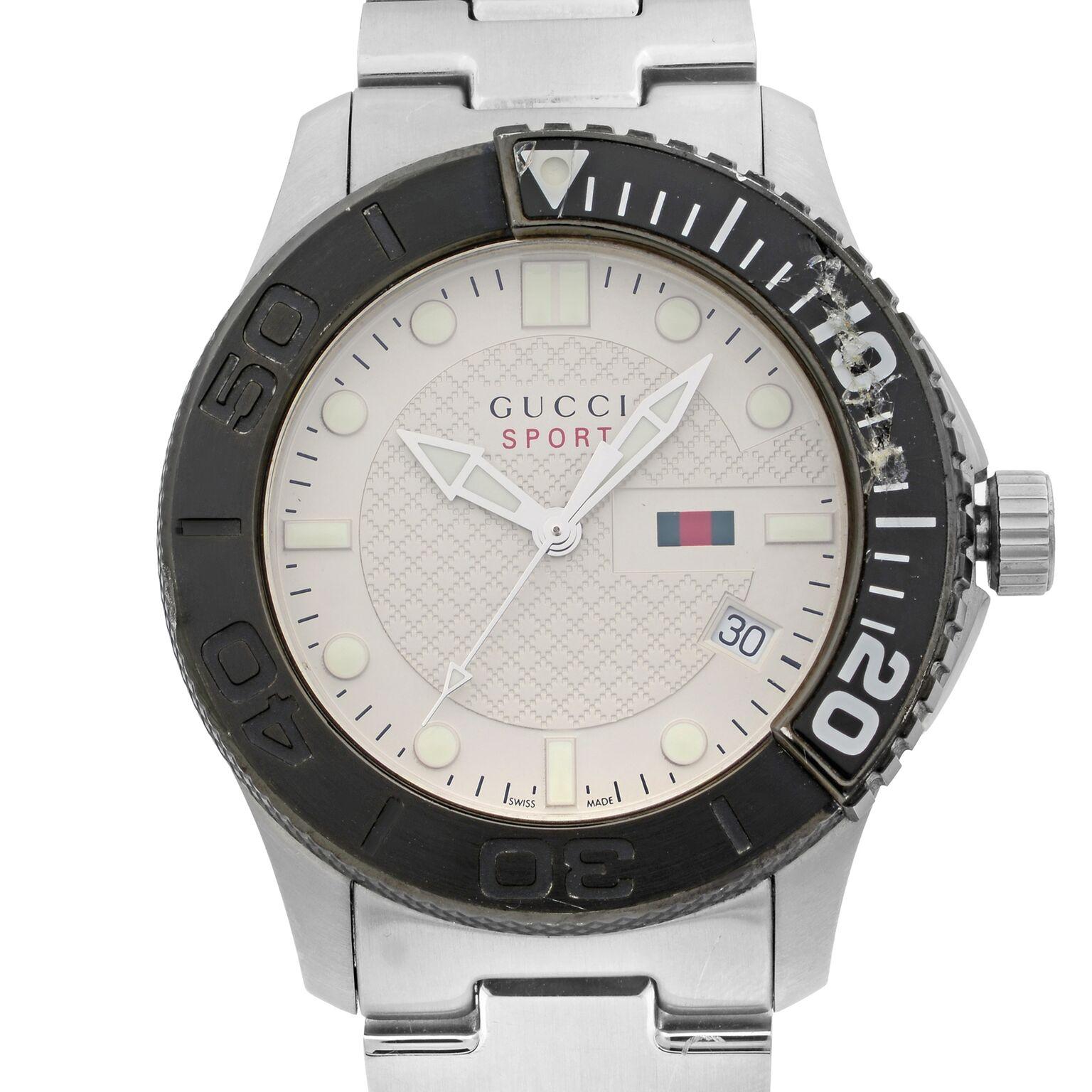 This pre-owned Gucci G-Timeless YA126250 is a beautiful men's timepiece that is powered by quartz (battery) movement which is cased in a stainless steel case. It has a round shape face, date indicator dial and has hand sticks & dots style markers.