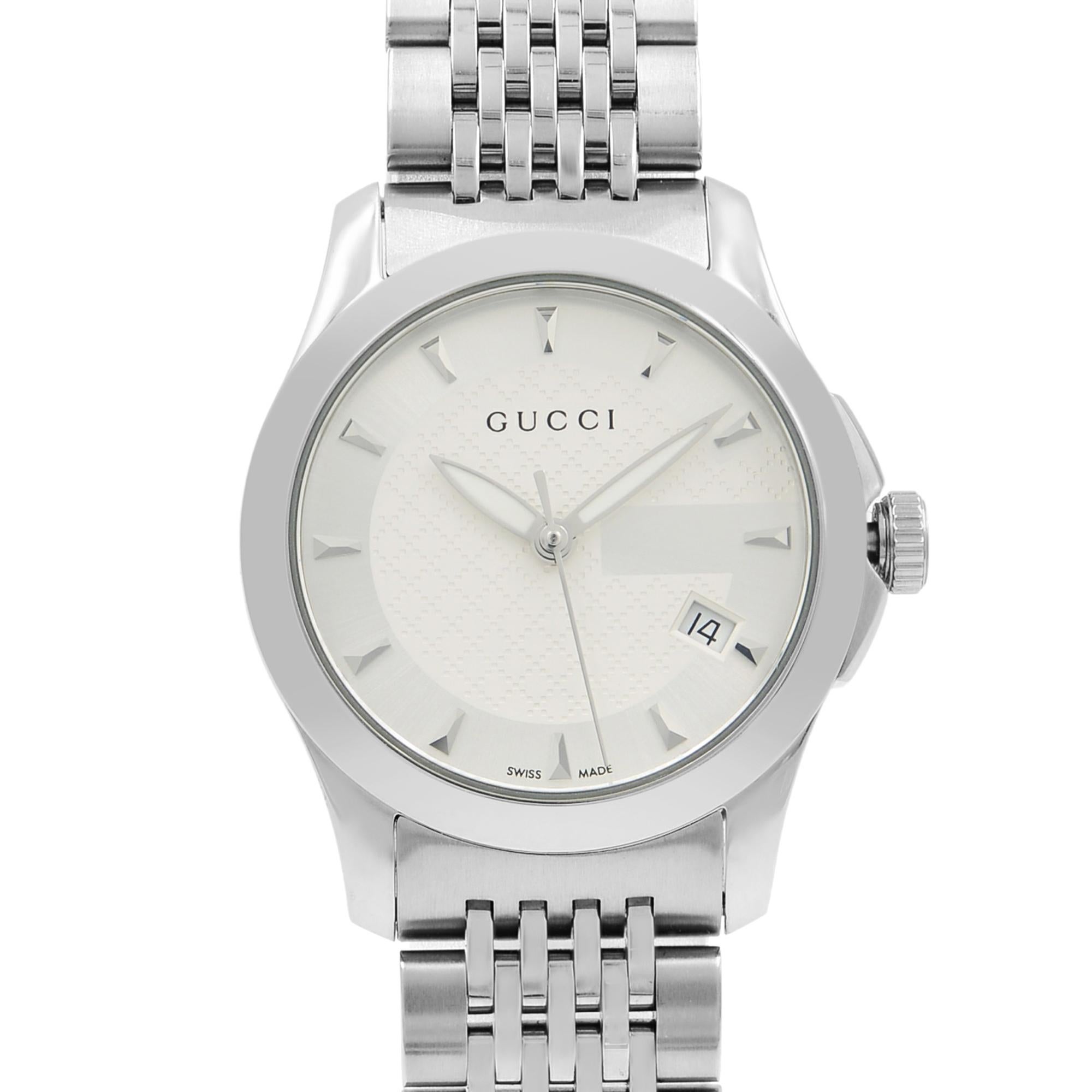 This pre-owned Gucci G-Timeless YA126501 is a beautiful Ladies timepiece that is powered by a quartz movement which is cased in a stainless steel case. It has a round shape face, date dial and has hand sticks style markers. It is completed with a