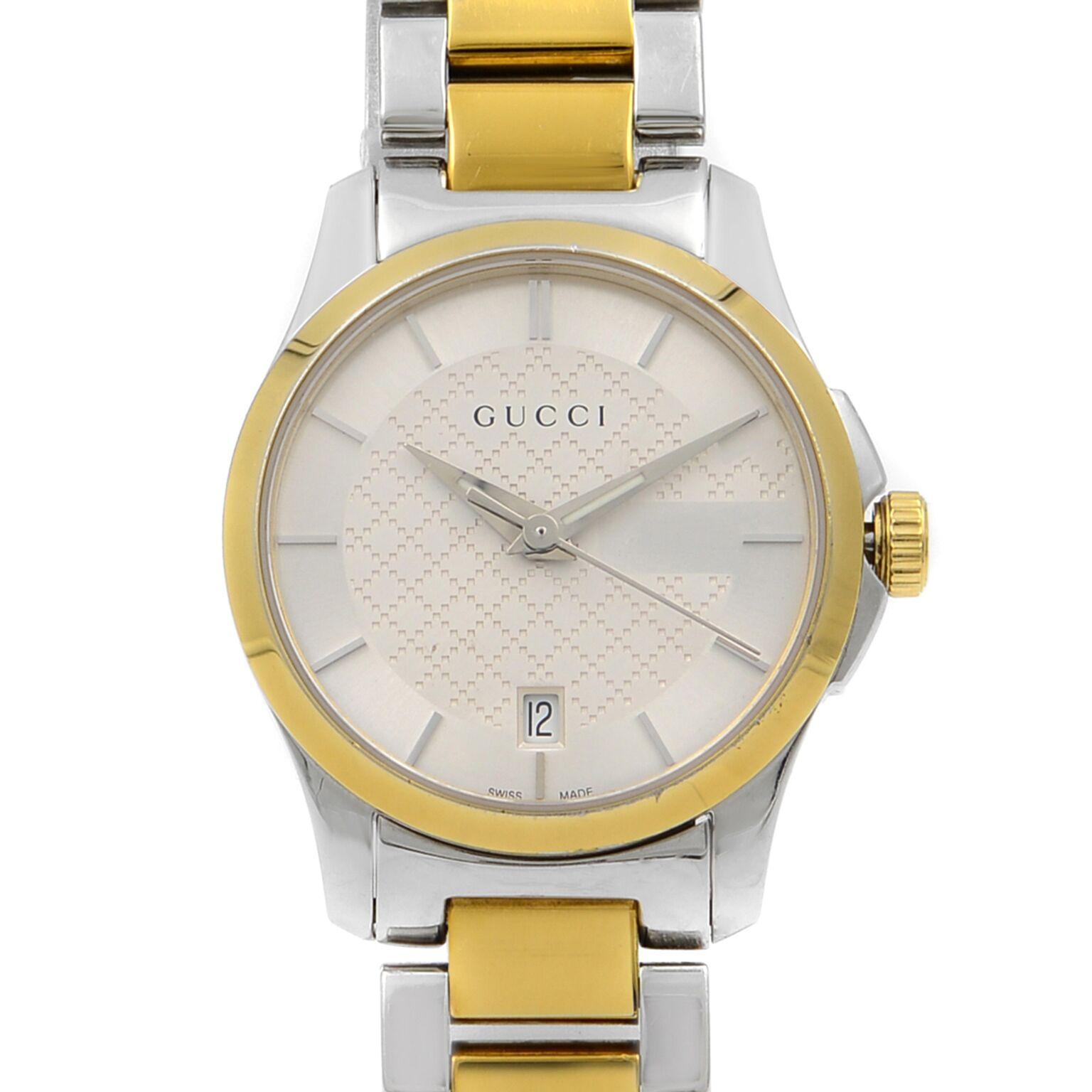 This pre-owned Gucci G-Timeless YA126531 is a beautiful Ladies timepiece that is powered by a quartz movement which is cased in a stainless steel case. It has a round shape face, date dial and has hand sticks style markers. It is completed with a