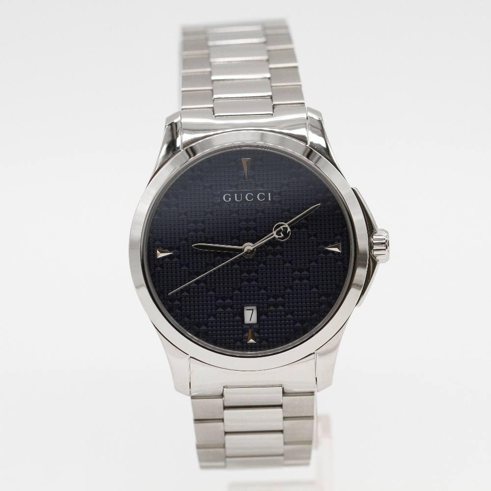 GUCCI G-TIMELESS Watch YA1264025 Brand New Watch, 38mm stainless steel case excluding crown. Case thickness 7mm. Sapphire crystal. Blue dial. Stainless steel bracelet 19mm wide. Folding buckle. Quartz movement. Water resistant 3atm. Delivered with