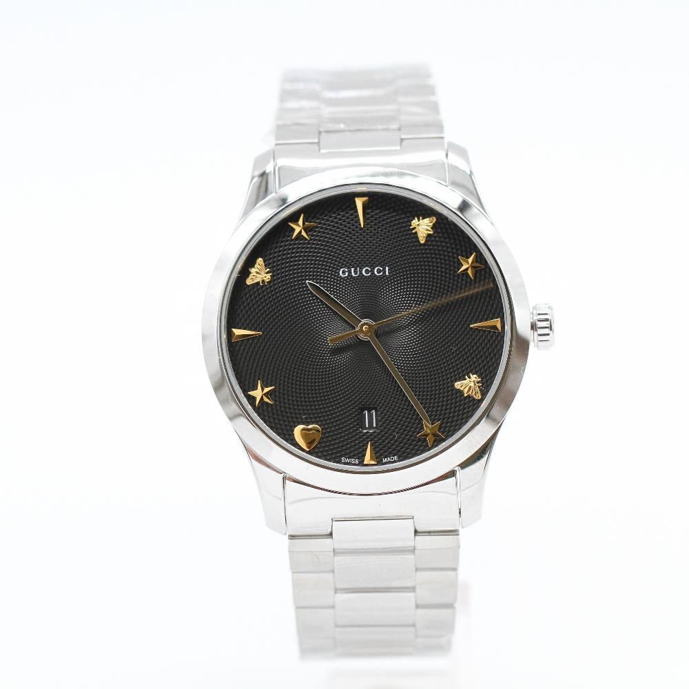 GUCCI G-TIMELESS Watch YA1264029A Brand New Watch, 38mm stainless steel case excluding crown. Case thickness 9mm. Sapphire crystal. Blue dial. Stainless steel bracelet, 19mm wide. Folding buckle. Quartz movement. Water resistant 3atm. Delivered with