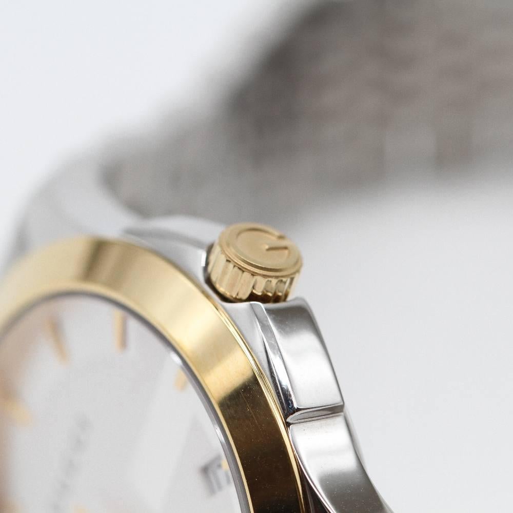 GUCCI G-TIMELESS Watch YA126409 Brand New Watch, 38mm stainless steel case excluding crown. Case thickness 8.25mm. Sapphire crystal. Silver dial. Gold plated stainless steel bracelet 20mm wide. Folding clasp. Quartz movement. Water resistant 5atm.