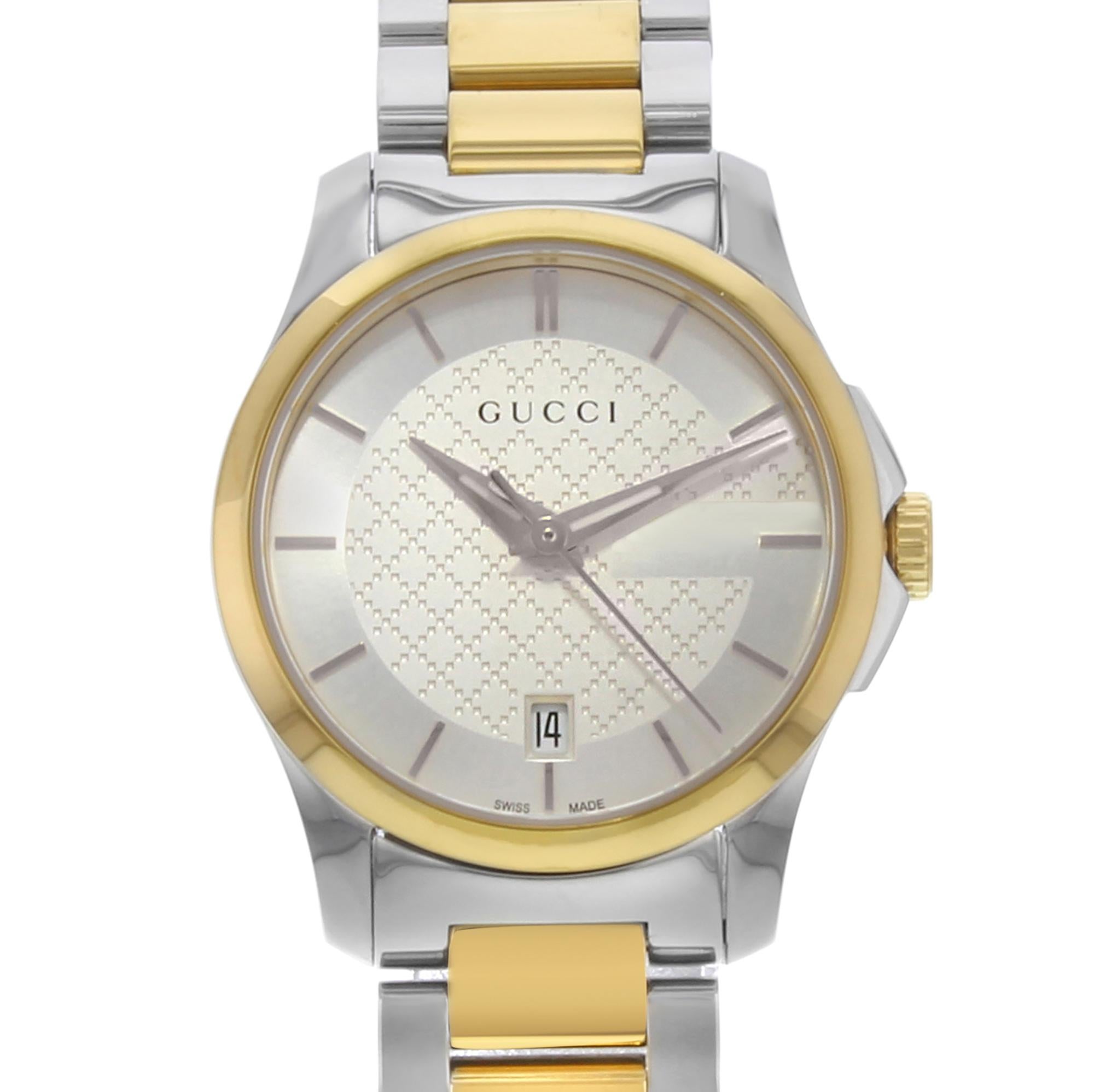 Diese gebrauchte Gucci G-Timeless YA126531 ist eine schöne Damenuhr:: die von einem Quarzwerk angetrieben wird:: das in einem Edelstahlgehäuse untergebracht ist. Es hat eine runde Form Gesicht:: Datum Zifferblatt und hat Hand Sticks Stil