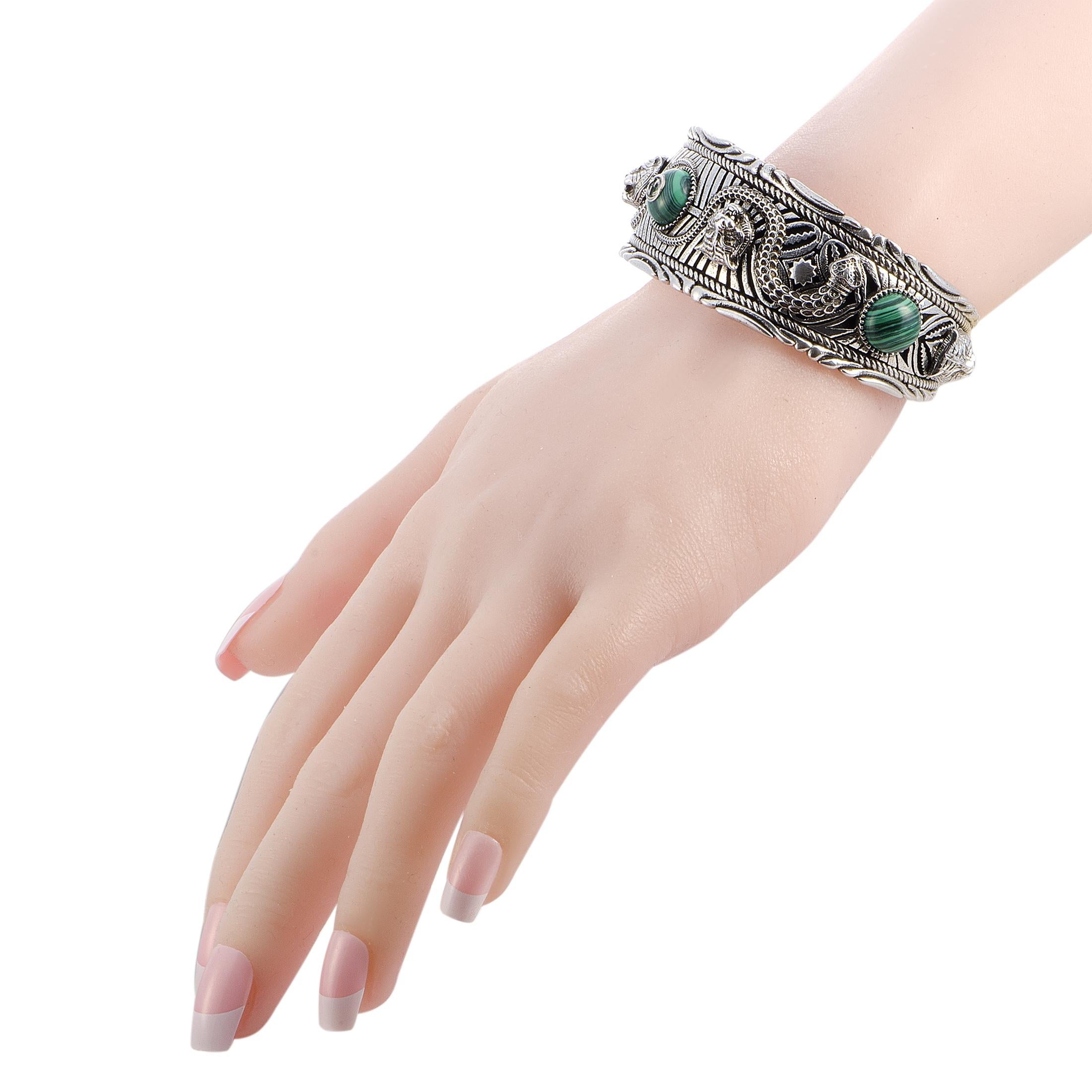 The Gucci “Garden” bracelet is made out of silver and green resin and weighs 86 grams. The bracelet measures 8” in length and 2.55” in diameter.
 
 This item is offered in brand new condition and includes the manufacturer’s box and papers.
