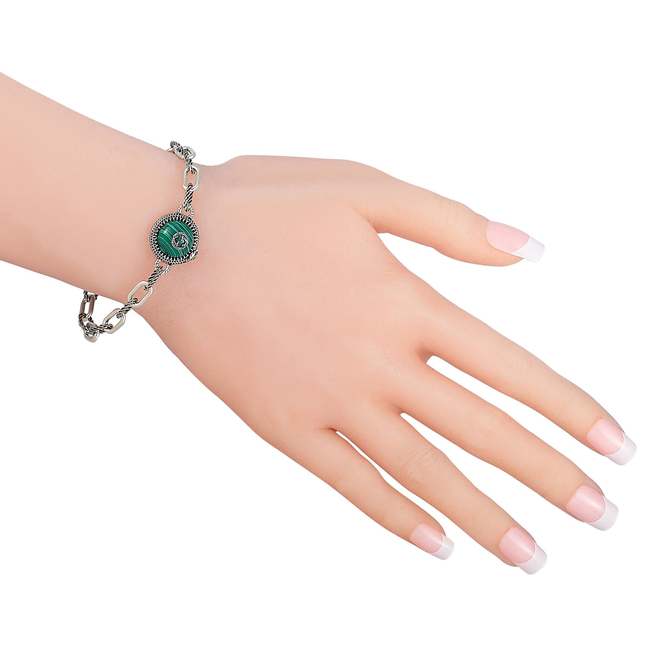 The Gucci “Garden” bracelet is made of sterling silver and embellished with malachite. The bracelet weighs 13.2 grams and measures 7.50” in length.

This jewelry piece is offered in brand new condition and includes the manufacturer’s box and papers.