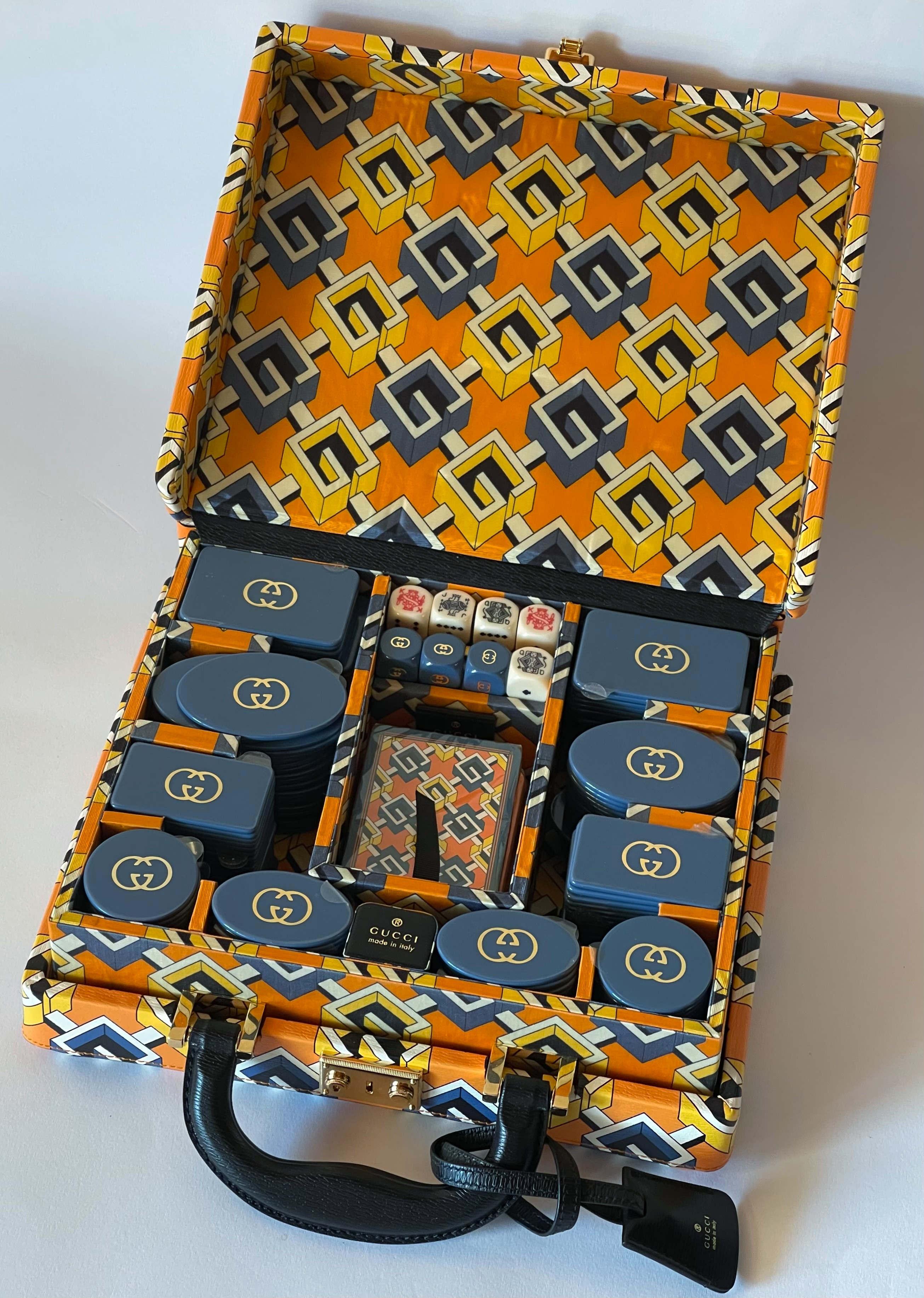 The '50s and '60s archives reveal a selection of intricately designed pieces from the world of sports and leisure. Inspired by these items' playful spirit and curated details, this NEW briefcase poker card game set is presented in Geometric G print