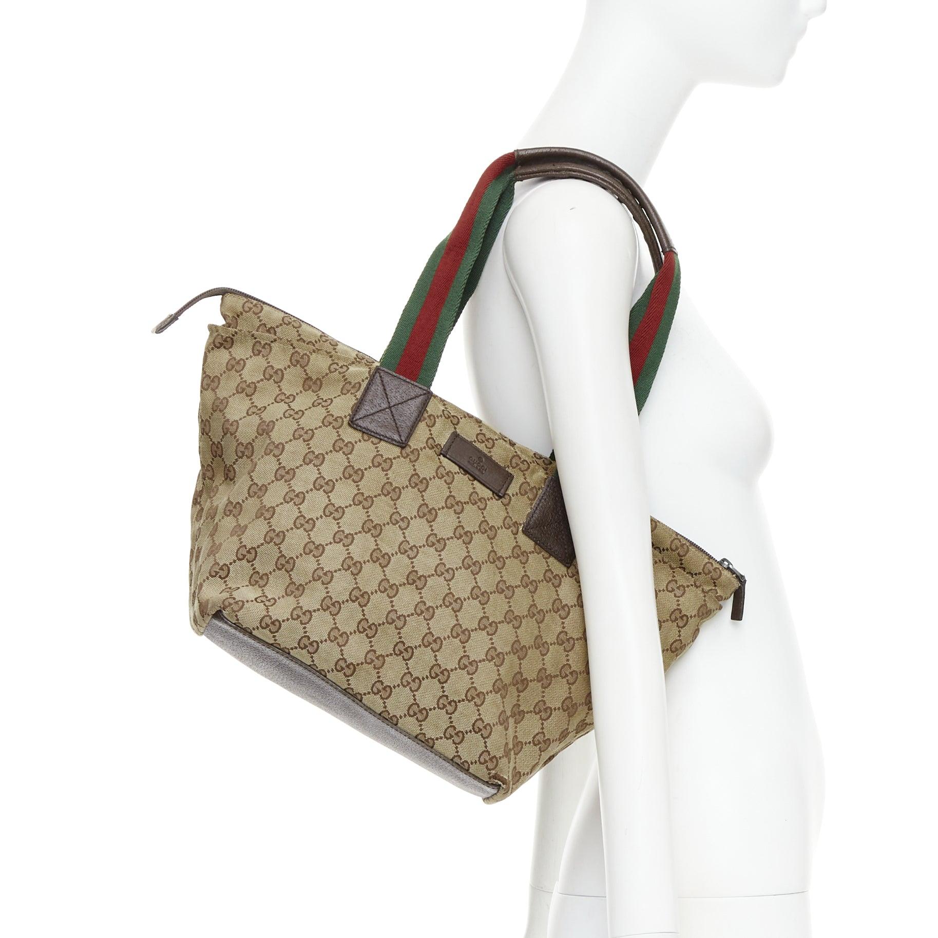 GUCCI GG beige canvas web sherry line leather trim tote bag
Reference: CNPG/A00105
Brand: Gucci
Material: Canvas, Leather
Color: Brown, Green
Pattern: Monogram
Closure: Zip
Lining: Brown Fabric
Made in: Italy

CONDITION:
Condition: Good, this item