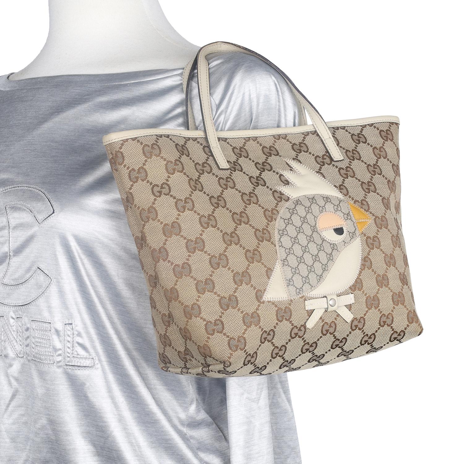 Authentic, pre-loved Gucci GG brown monogram zoo tote for adult or child.  This chic Gucci tote bag is a must-have for Gucci lovers and children. The roomy interior is ideal for everyday necessities with the sophisticated style of Gucci. You won't