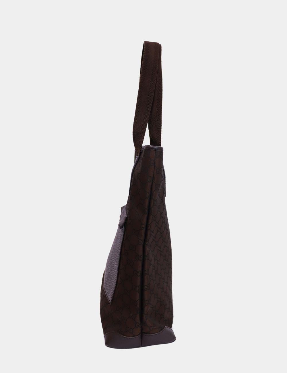 Gucci GG Canvas Brown Tote Bag, Features two handles for shoulder, GG canvas, and one exterior pocket.

Material: Canvas and Leather
Hardware: Silver
Height: 37cm
Width: 29cm
Depth: 12cm
Handle Drop: 20cm
Overall condition: Good
Interior condition: