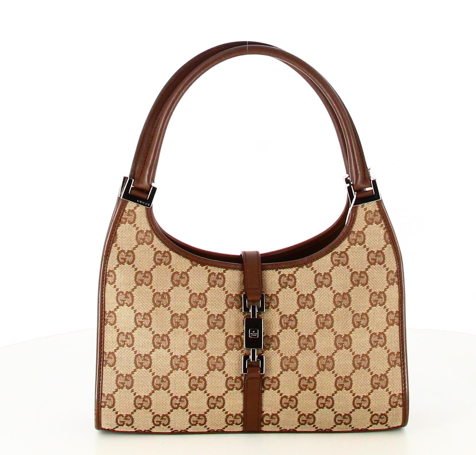 Gucci GG Canvas Handbag Jackie Bardot

- Very good condition. Shows very slight signs of wear over time.
- Gucci Handbag 
- Monogram canvas 
- Double brown leather straps 
- Clasp: Silver hook 
- Inside: monogrammed lining plus one zipped inside
