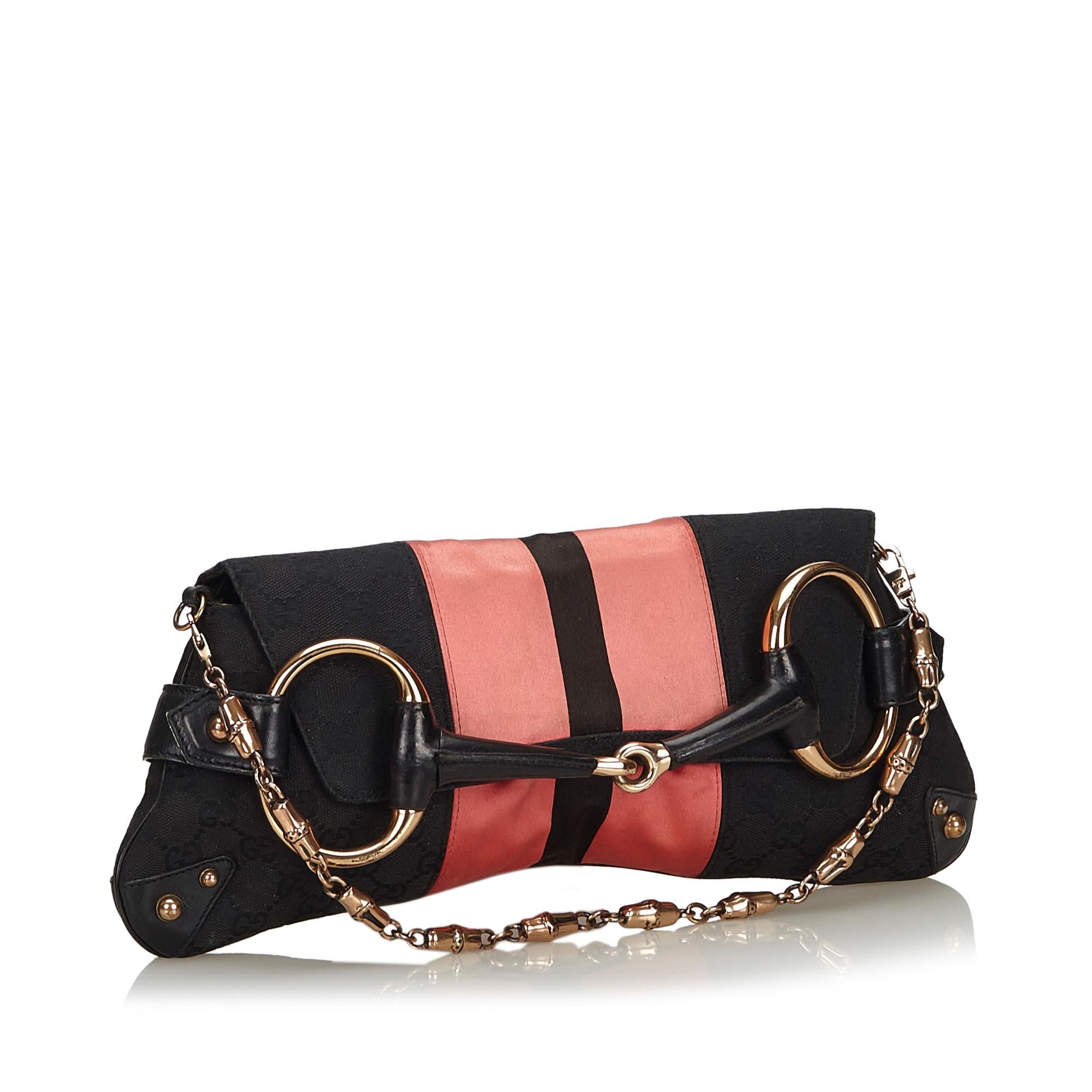 Gucci GG Canvas Horsebit Chain Baguette

This baguette features a canvas body with leather trim, metal bamboo straps, a front flap with horsebit details, and an interior slip pocket. 

Approx. 

Length: 16 cm. 
Width: 36 cm. 
Depth: 1 cm. 
Drop: 17
