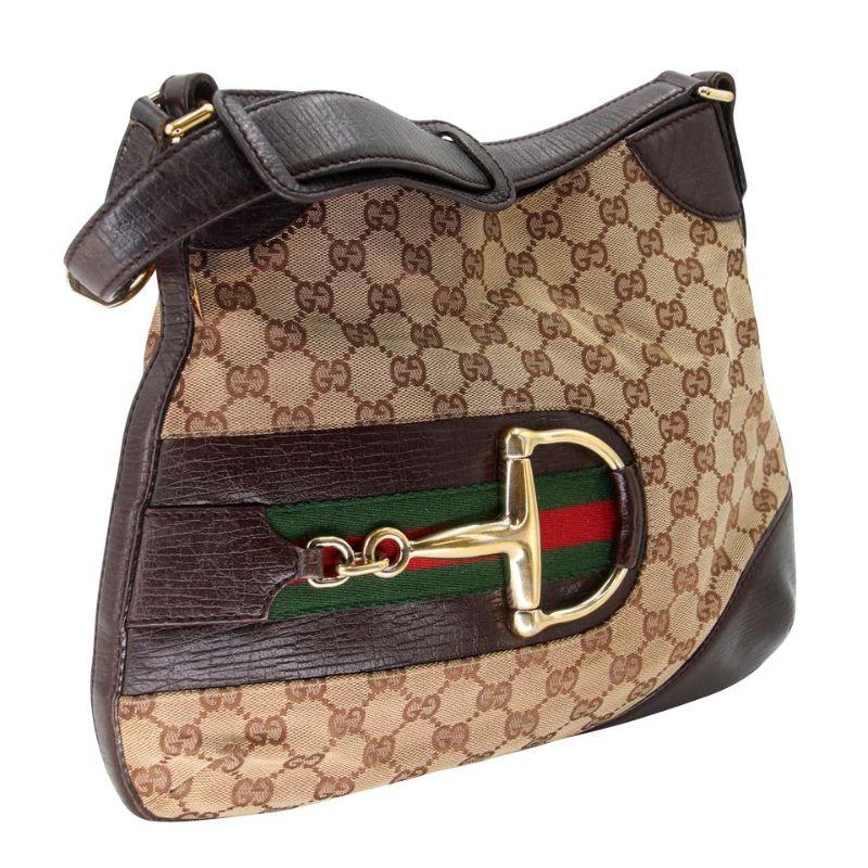 Gucci GG Canvas Horsebit Hasler Supreme Hobo Bag GG-0618N-0001

Coming from the house of Gucci, this Hasler Horsebit shoulder bag features the iconic beige coated canvas body with the 'GG' web detailing on it and completed with leather trims. It