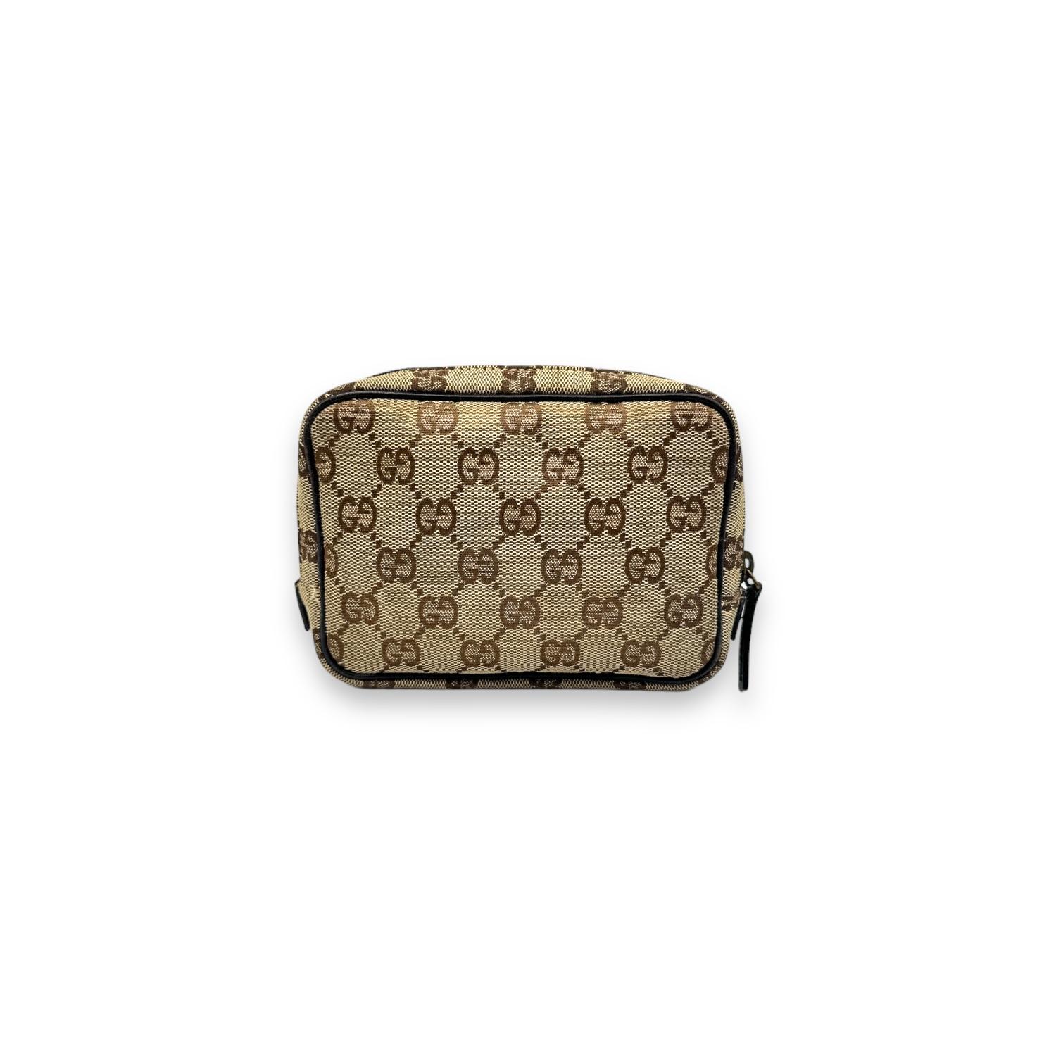 Travel in style with the Gucci GG Canvas Leather Zip Toiletry Bag Pouch. Made with a durable canvas and leather trim, this pouch features a secure zipper closure and spacious interior for all your travel essentials.

Brand: Gucci
Date/Authenticity