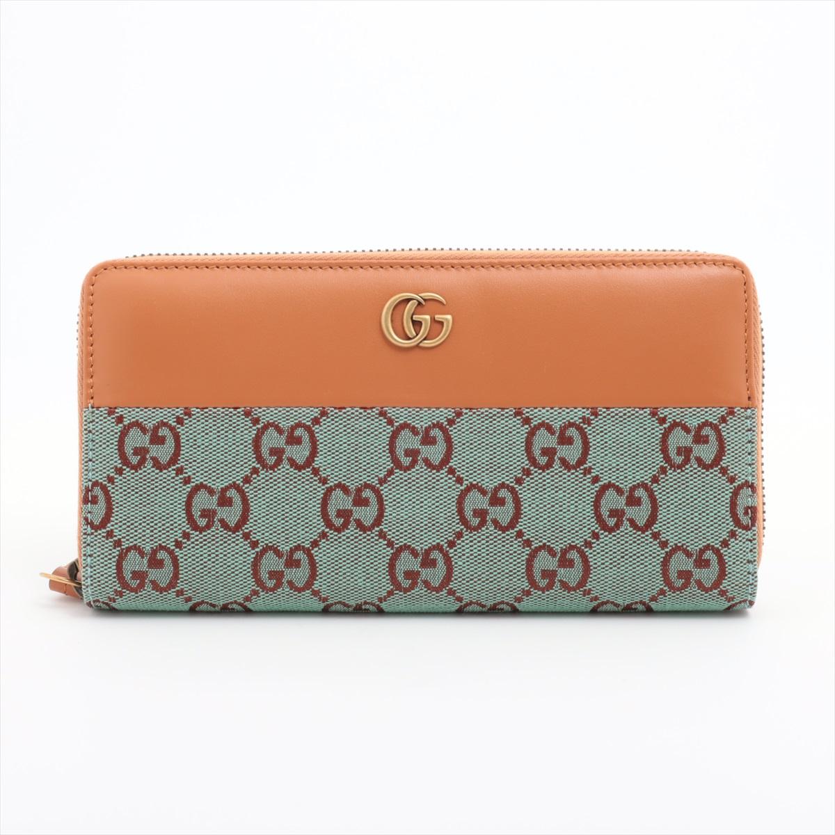 The Gucci GG Canvas Leather Zippy Wallet in Pale Blue and Brown is a stylish and practical accessory that combines elegance with functionality. Crafted from Gucci's signature GG canvas in a soft pale blue hue, the wallet features rich brown leather