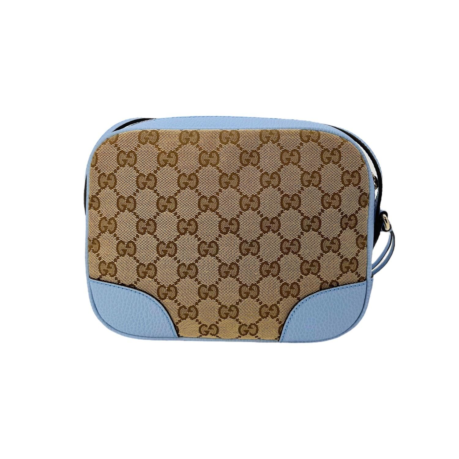 This Gucci GG Canvas Mini Bree Crossbody Bag was made in Italy and it is finely crafted of the classic Gucci GG canvas exterior with leather trimming and gold-tone hardware features. It has a flat leather adjustable shoulder strap. It has a zipper