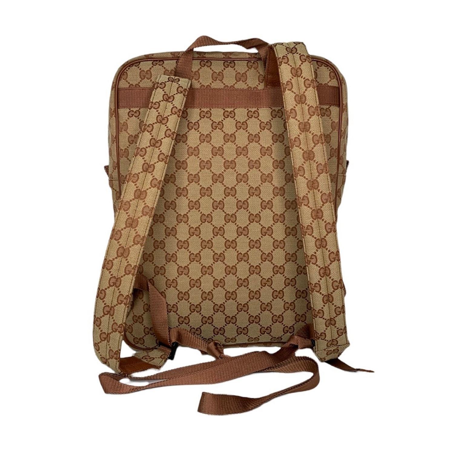 A limited edition collectible from Gucci, the Original GG canvas gets a sporty update with white New York Yankees logo embroidery, trimmed with rust orange leather and finished with antiqued silver-tone hardware. The padded backpack straps are