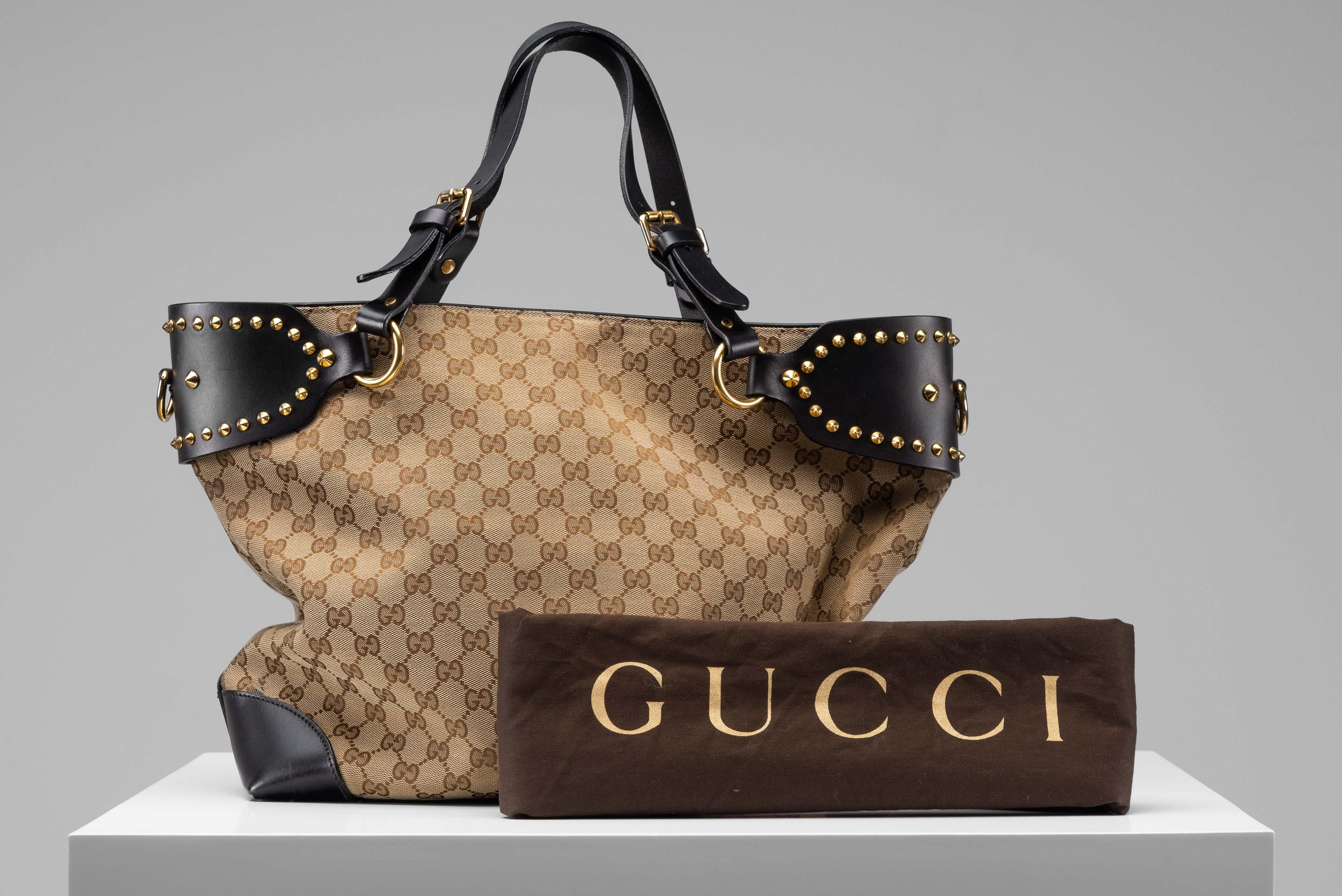 From the collection of SAVINETI we offer this Gucci GG Studded Patti Tote:
-    Brand: Gucci 
-    Model: GG Studded Patti Tote
-    Condition: Very Good Condition
-    Materials: canvas, leather, gold-tone hardware
-    Extras: