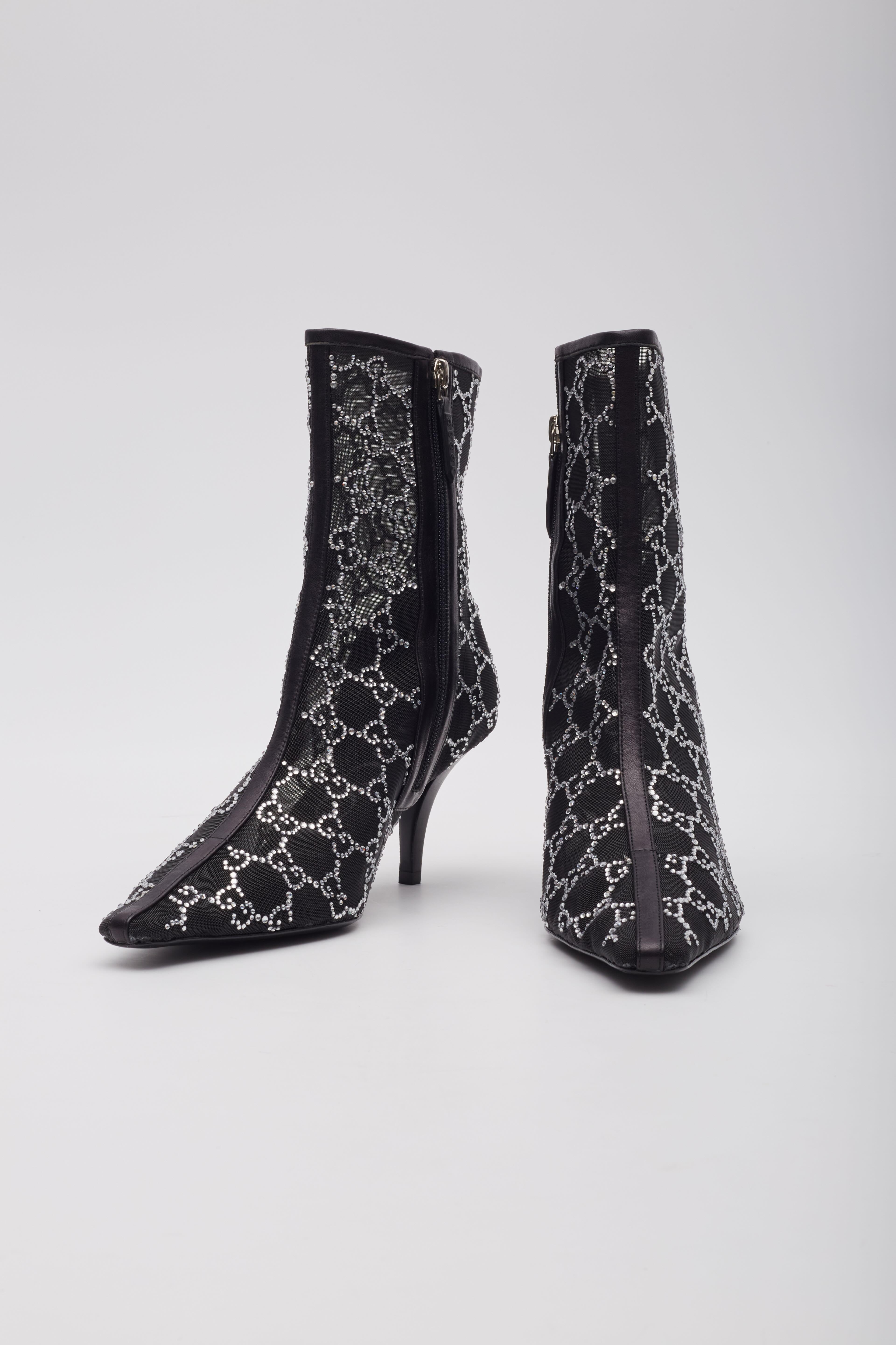 Color: Black with shiny crystals
Material: Mesh, leather and crystals

EU 39
Heel Height: 75 mm / 3