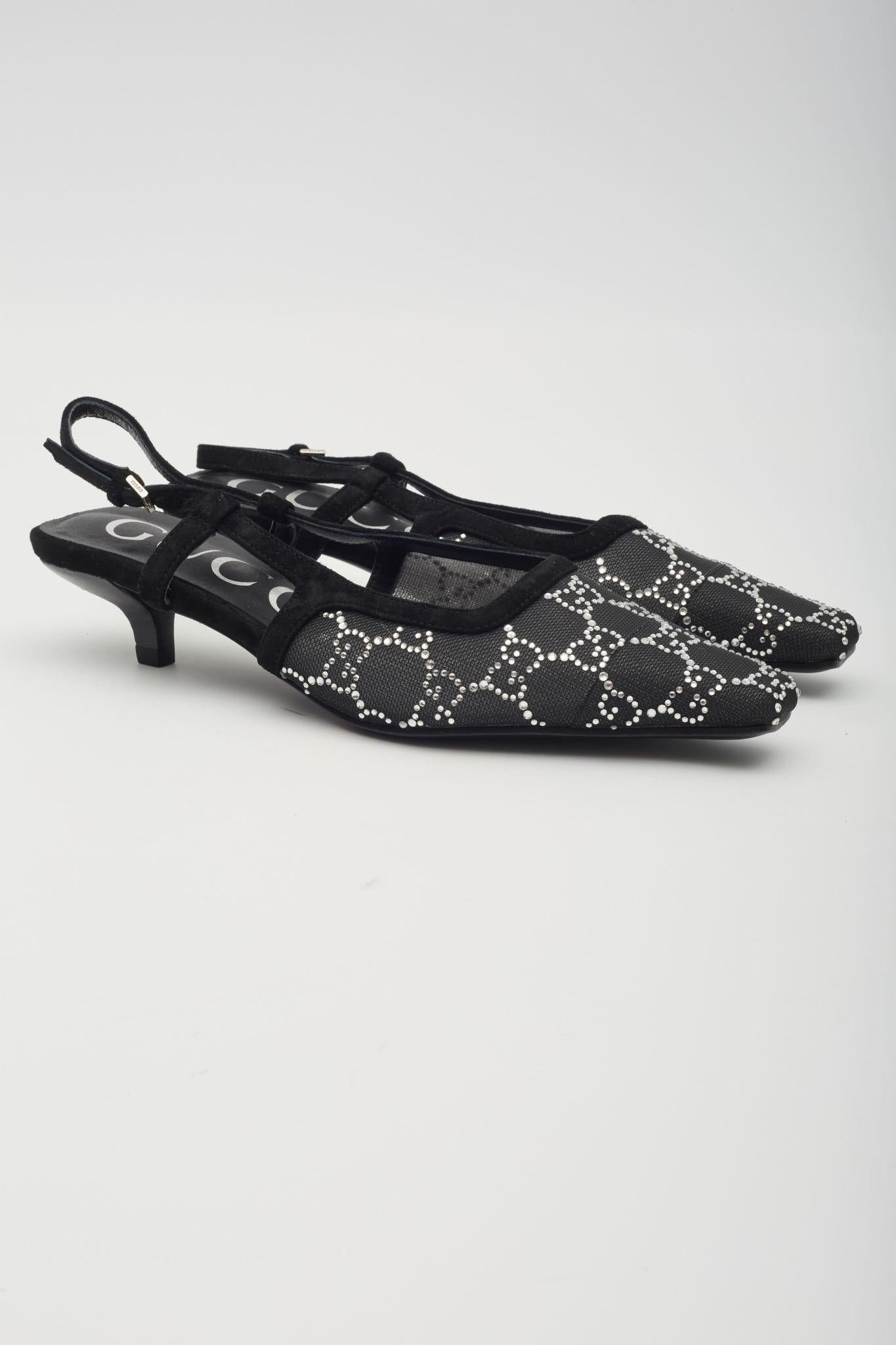 The pumps are part of Gucci’s Aria collection and feature black mesh construction with GG crystal embellishments, tonal suede details, pointed square toe, a leather sole, back buckle closure and a low heel 1.5 inch (38mm) heel. Outlet.

Color: