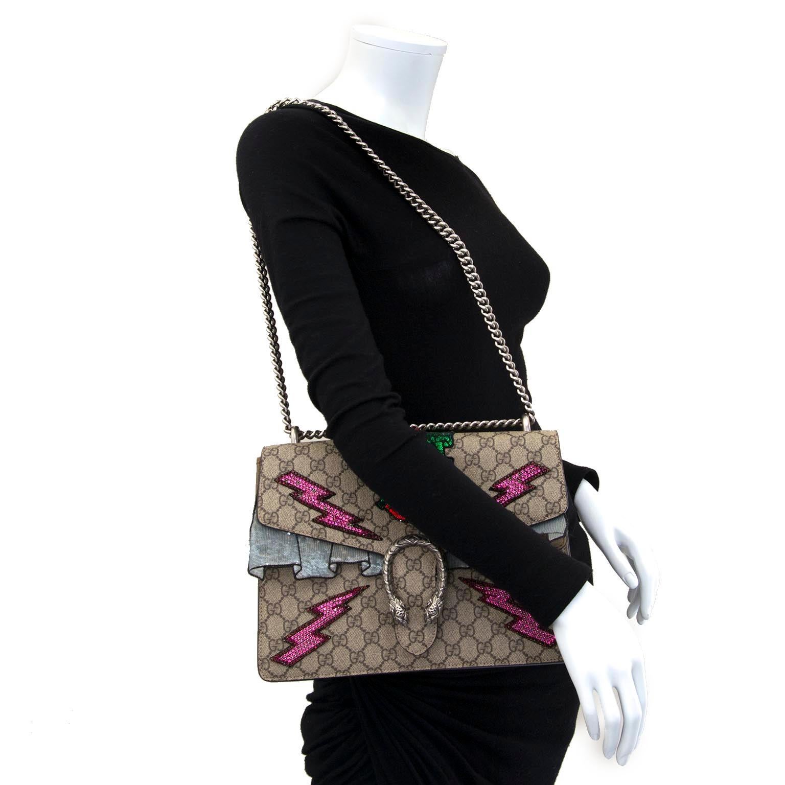 Excellent condition

Gucci GG Dionysus Supreme Embroidered Monogram Shoulder Bag

Stand out with this gorgeous bag by Gucci. 
This bag is crafted of traditional Gucci GG Monogram supreme canvas and finished with four pink lightening bolts and red