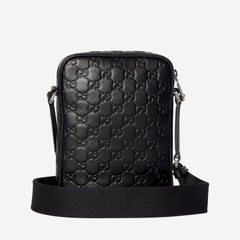 Gucci GG Embossed Leather Crossbody Bag — Black