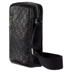 Gucci GG Embossed Leather Crossbody Bag — Black