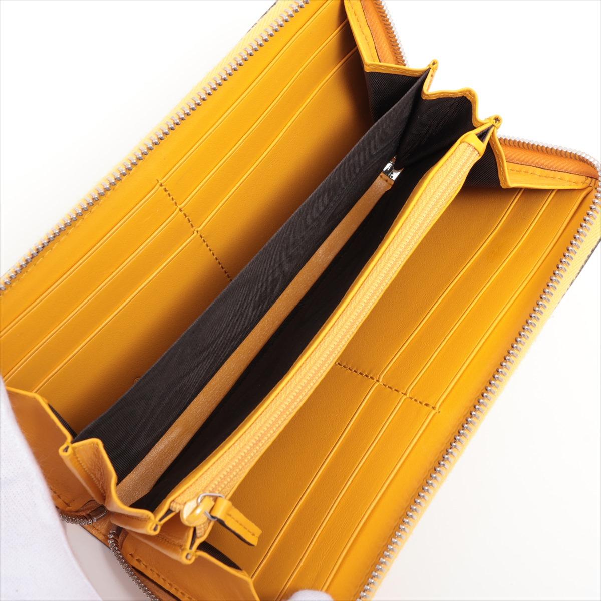 Women's Gucci GG Embossed Leather Zip Long Wallet Yellow