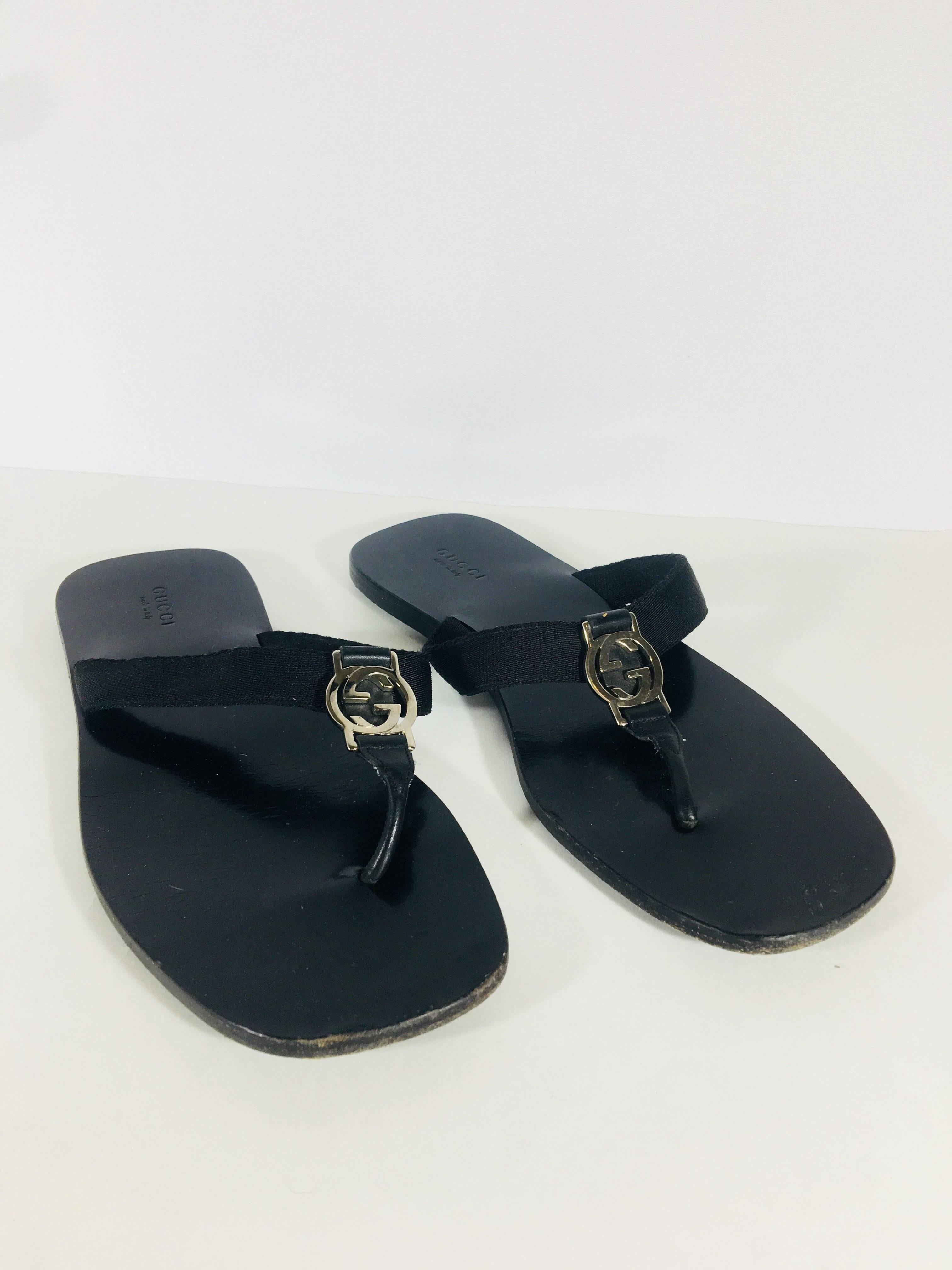 Gucci GG Flip Flops with Silver GG Hardware.