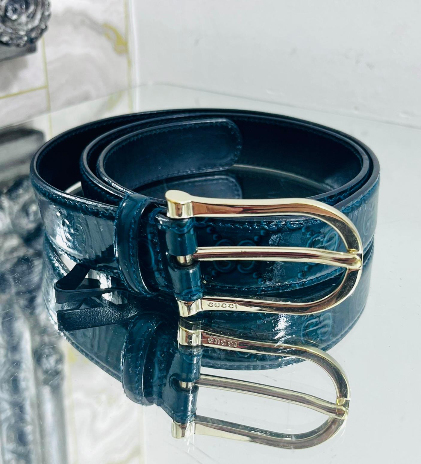 Gucci 'GG' Guccissima Patent Leather Belt

Dark teal belt designed with iconic Guccissima pattern.

Detailed with gold 'Gucci' engraved buckle.

Size – 100cm

Condition – Very Good

Composition – Patent Leather

Comes with – Belt Only