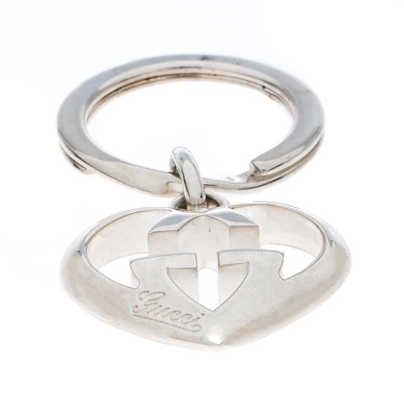 A key ring for the fashionistas, this Gucci piece is a collectible. It features the signature GG logo charm attached to a ring. This silver key chain is complete hallmark engravings.

Includes: The Luxury Closet Packaging, Price Tag

